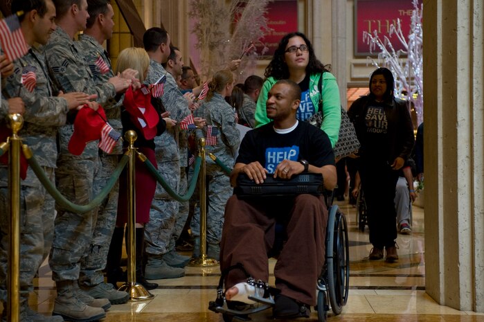 Wounded warriors and family members receive a red carpet welcome from Nellis Airmen during a "Salute Our Troops" celebration Dec. 5, 2012, in Las Vegas. A dozen wounded warriors and their family members received VIP treatment that includes world class entertainment, dining, and relaxation during their stay in Las Vegas. (U.S. Air Force photo by Airman 1st Class Christopher Tam)