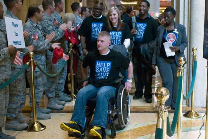 Wounded veterans and their family members receive a red carpet welcome during a "Salute Our Troops" celebration Dec. 5, 2012, in Las Vegas. A local casino and the Armed Forces Foundation joined together to provide the wounded warriors a few days of relaxation and entertainment. (U.S. Air Force photo by Airman 1st Class Monet Villacorte)