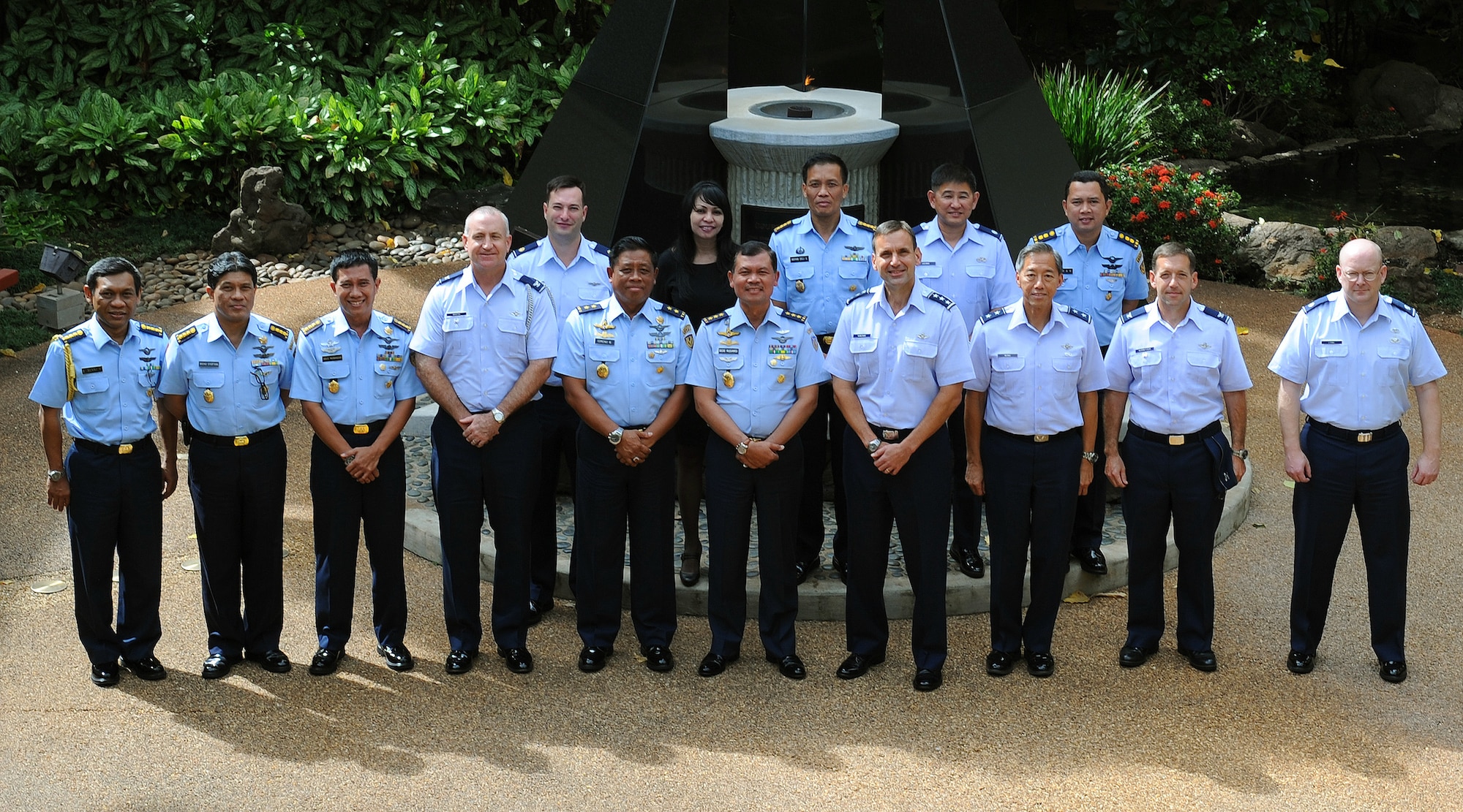 Lt. Gen. Ted Kresge, Pacific Air Forces vice commander; Air Marshal Ded Rusamsi, Vice Chief (Wakasau) of Staff Indonesian Air Force (center); and U.S. and Indonesian staff members pose for a group photo in front of the eternal flame at the Courtyard of Heroes during the sixth annual United States and Indonesian Airman-to-Airman talks here at PACAF headquarters, Joint Base Pearl Harbor-Hickam, Hawaii, Dec. 4, 2012. The Airman-to-Airman talks between the Indonesian Air Force and Pacific Air Force is a forum to plan and discuss future Operation Activities and Actions and additional engagement opportunities.    (U.S. Air Force photo/Tech. Sgt. Jerome S. Tayborn)