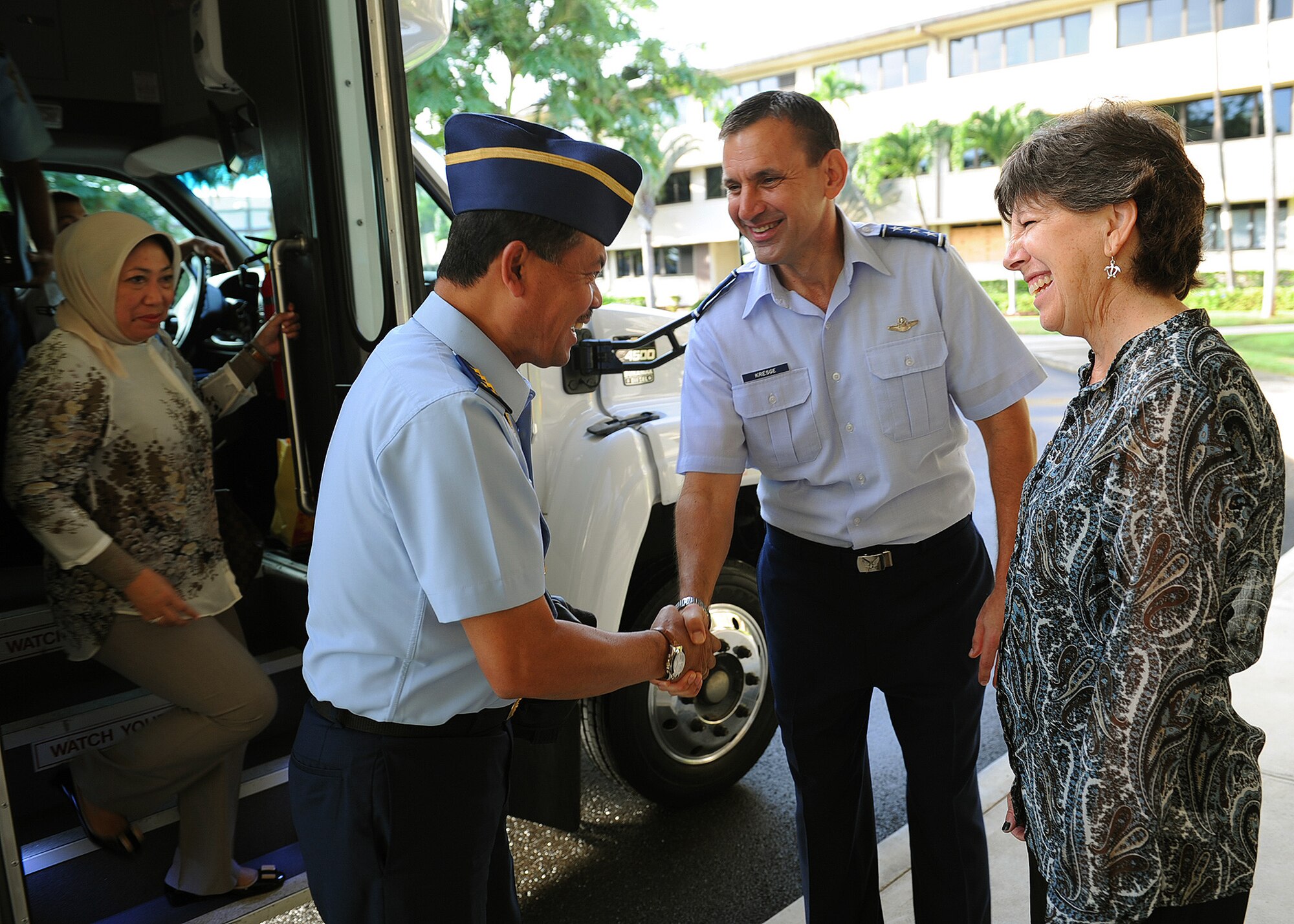 Air Marshal Ded Rusamsi, Vice Chief (Wakasau) of Staff Indonesian Air Force and his spouse Mrs. Rina Indriati (left) are  greeted by Lt. Gen. Ted Kresge, Pacific Air Forces vice commander, and his spouse Mrs. Lorrie Kresge, at PACAF headquarters, Joint Base Pearl Harbor-Hickam, Hawaii, Dec. 4, 2012. Rusamsi visited PACAF to participate in Airman-to-Airman talks and discuss topics of mutual interest with senior military leaders. (U.S. Air Force photo/Tech. Sgt. Jerome S. Tayborn)