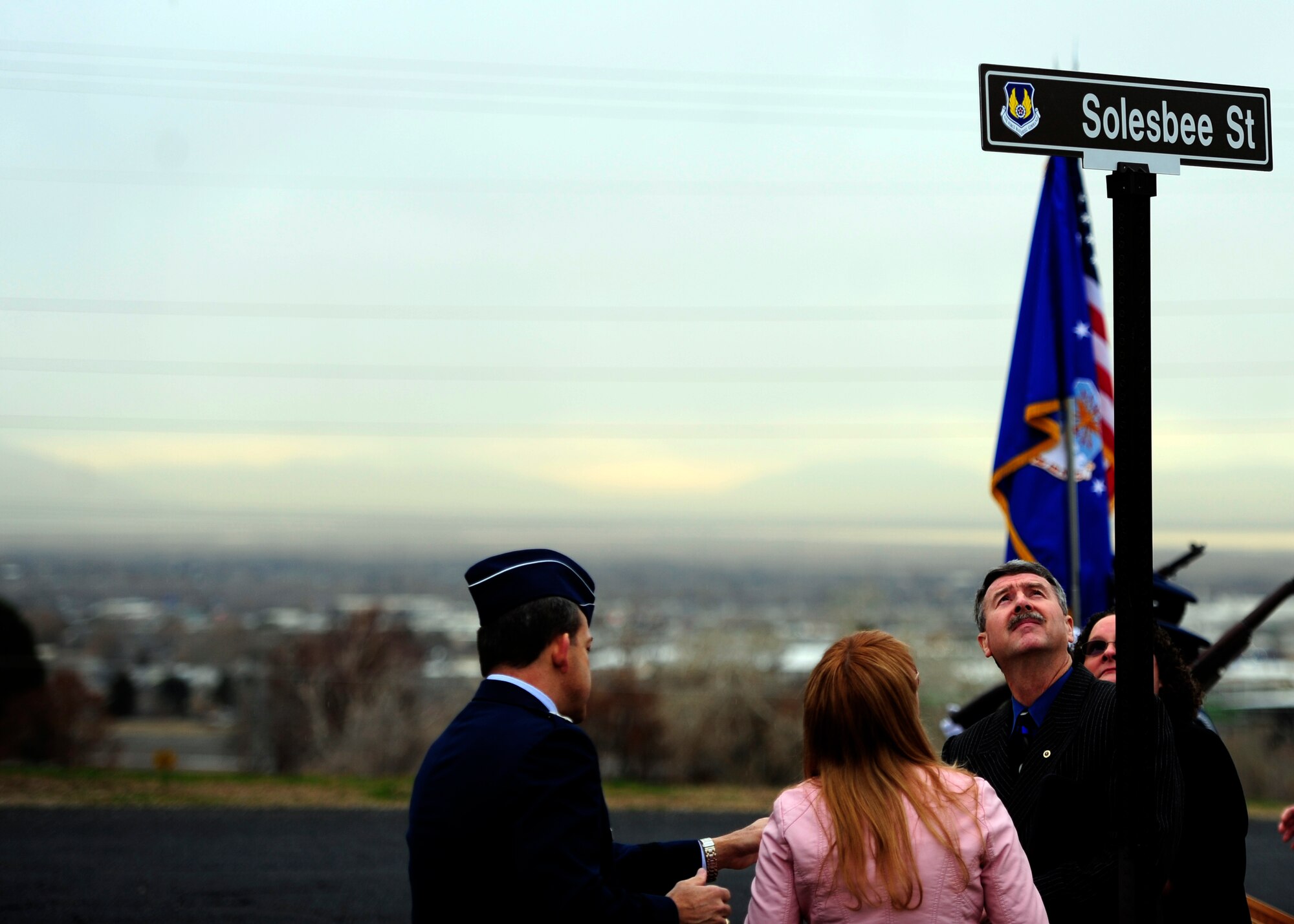 Family members of Tech. Sgt. Kristoffer M. Solesbee, a Hill AFB EOD technician, look at the new street sign unveiled during a Dec. 4 street renaming ceremony. The installation's 12th Street was renamed in honor of Solesbee who lost his life in Afghanistan in May 2011. (U.S. Air Force photo/Airman 1st Class Justyn Freeman)