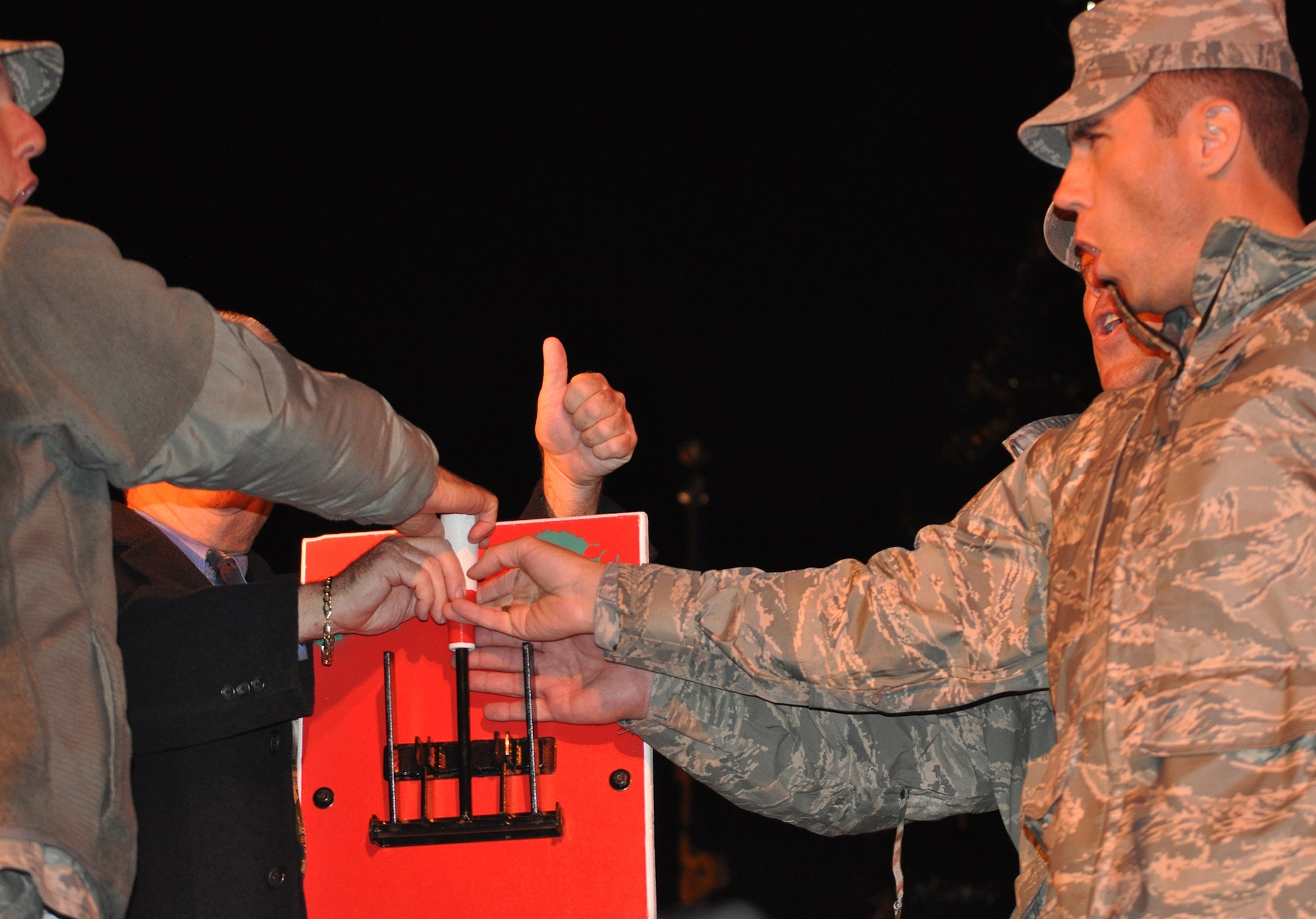 TRAVIS AIR FORCE BASE, Calif. -- Doing the honors were, from the left, Brig. Gen. John C. Flournoy, Jr., 349th Air Mobility Wing commander, The Honorable Steve Hardy, Mayor of Vacaville, Col. Darren Sprunk, 570th Contingency Response Group commander, and Col. John Klein, 60th AMW vice commander, on Nov. 30, 2012.(U.S. Air Force photo/Senior Master Sgt. Ellen Hatfield)