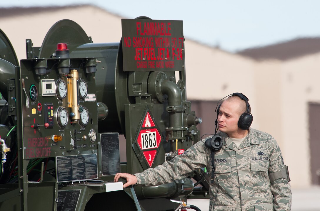 Staff Sgt. Anthony Espinoza, 28th Logistics Readiness Squadron petroleum oil and lubricants NCO in charge, monitors fuel gauges during a hot pit refueling activity at Ellsworth Air Force Base, S.D., Nov. 20, 2012. Hot pit refueling is a procedure performed in a combat environment to rapidly refuel aircraft while the aircrafts engines are running, which results in a speedy refueling an faster aircraft regeneration. (U.S. Air Force photo by Airman 1st Class Alystria Maurer/Released)  
