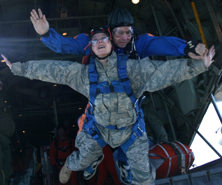 Public affairs officer, Capt. Cathleen Snow, 920th Rescue Wing, skydives with a Canadian jump master during a U.S., Canadian Search and Rescue Excersise in Summerside, Prince Edward Island, Canada. (Courtesy photo)