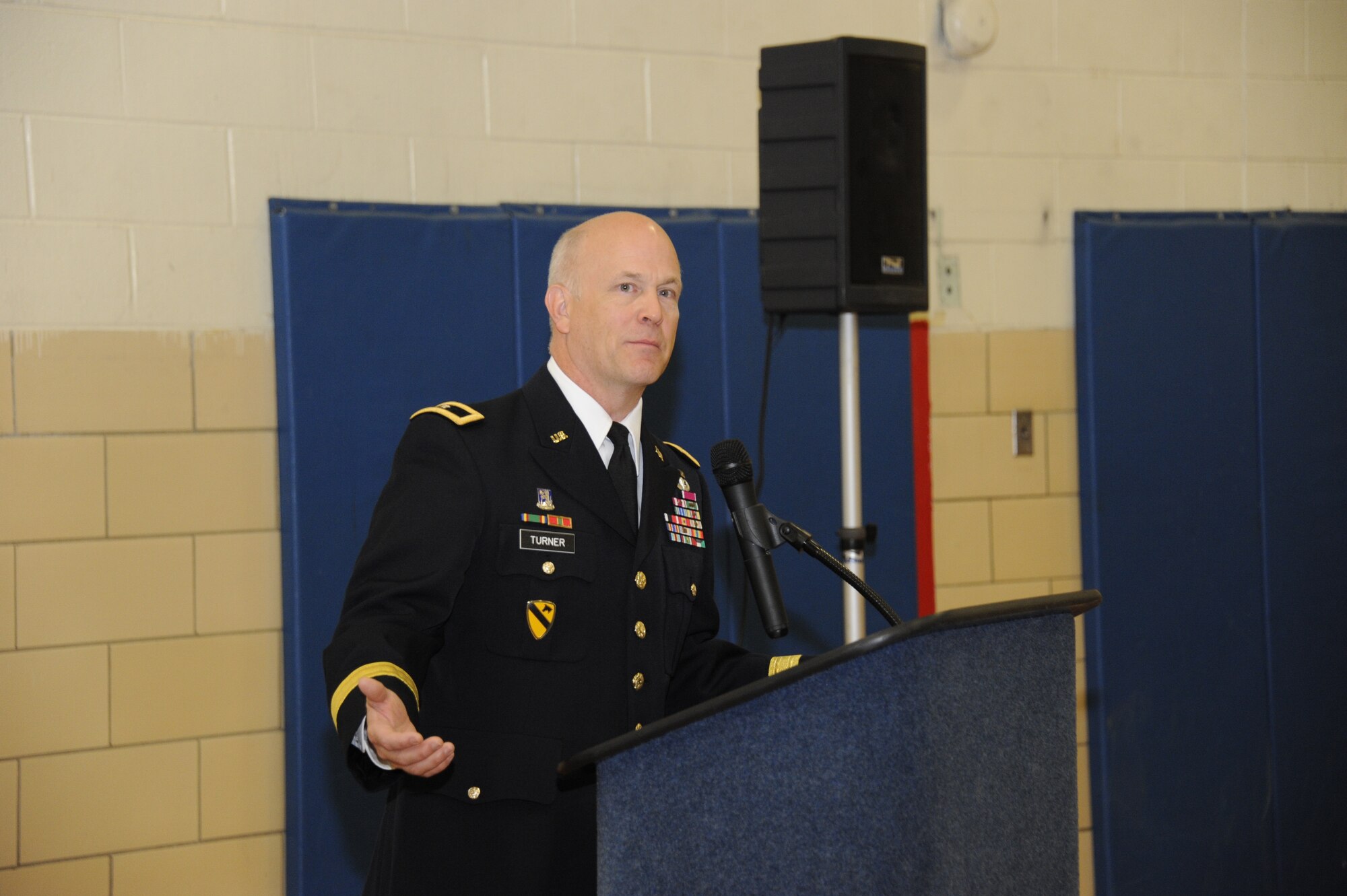 Brigadier General John H.H. Turner III, Atlantic Division, 75th Training Command (Mission Command), speaks during the 2nd Brigade 75th Training Division (Mission Command) redesignation ceremony Dec. 1, 2012, at Doughboy Gym. The unit was renamed during the ceremony to harmonize the unit's name with the other U.S. Army training commands. (U.S. Air Force photo by 2nd Lt. Alexis McGee/Released)
