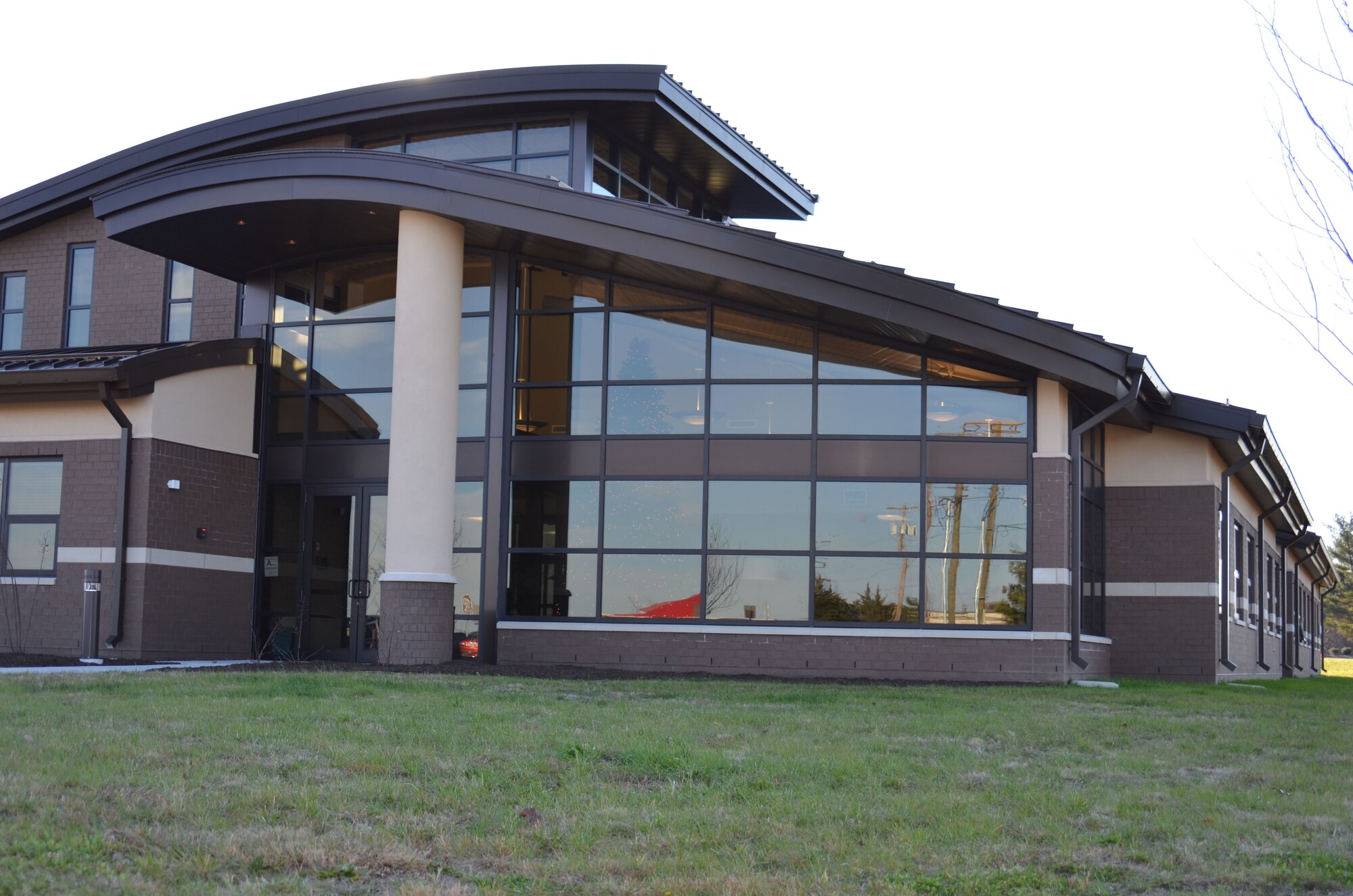 The new Military and Family Support Center facade shines in the sunlight. The MFSC welcomes service members and families to the ribbon cutting ceremony held from 1:30 to 2:30 p.m. today at 3435 Broidy Road. (U.S. Air Force photo by Kim Wright/Released)