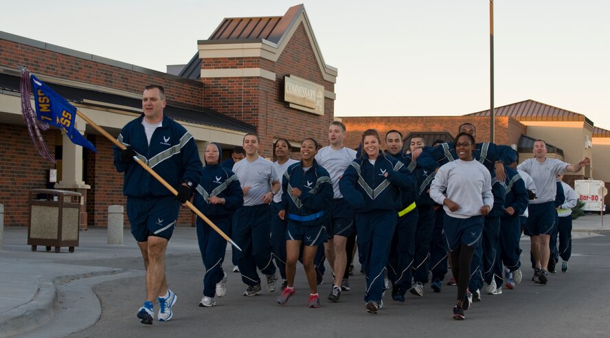 Airmen from the 7th Force Support Squadron participate in a pass in review run during Resiliency Week Dec. 5, 2012, at Dyess Air Force Base, Texas. The week’s purpose was to strengthen understanding and application of resiliency through team-building activities. (U.S. Air Force photo by Airman 1st Class Jonathan Stefanko/ Released)