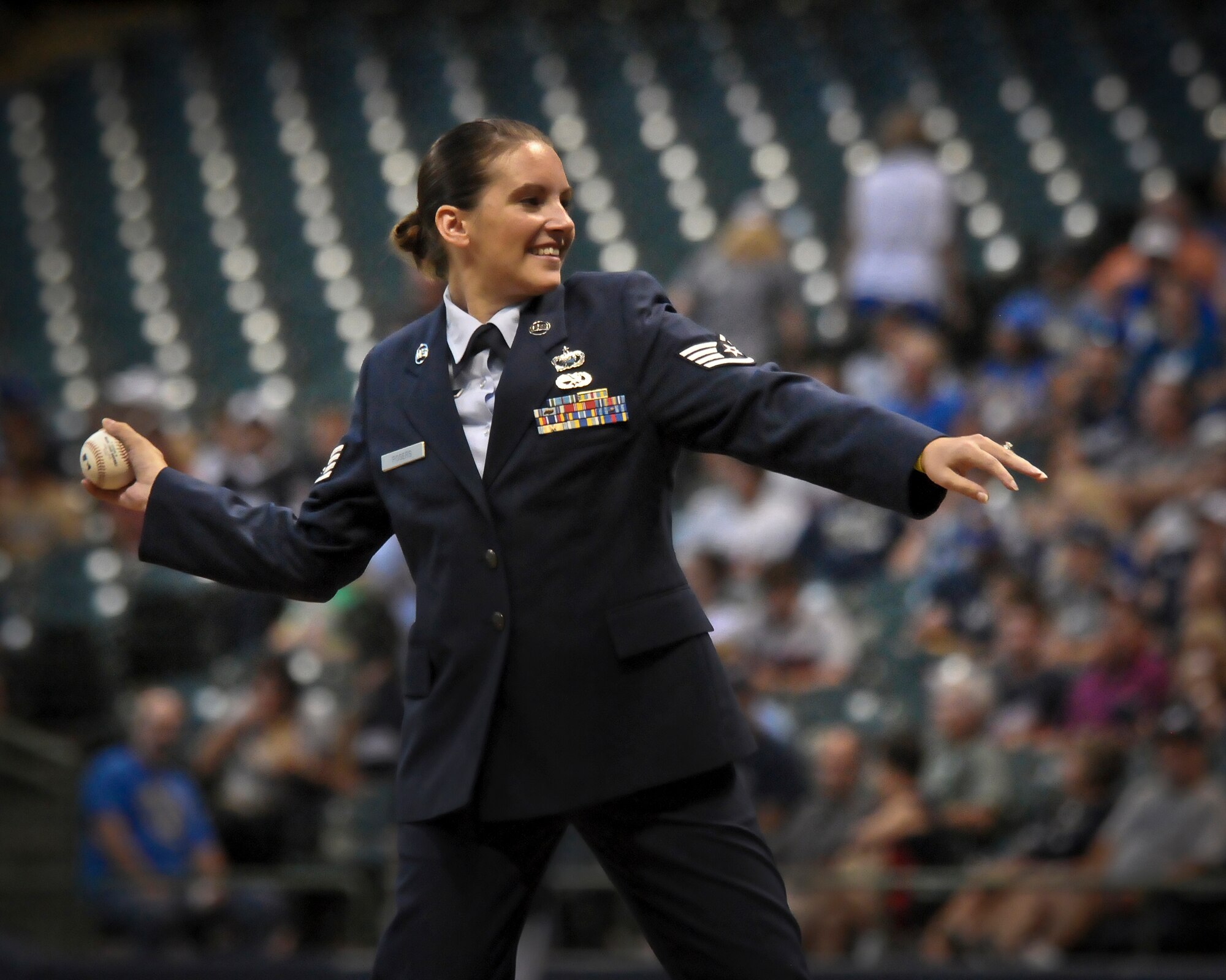 Staff Sgt. Leah Rogers winds up to deliver the ceremonial first pitch Miller Park in Milwaukee Wed., Sept. 12, 2012. 
Rogers, a Financial Management Specialist at the 128th Air Refueling Wing, recently returned home from an overseas deployment and was selected to represent the Wisconsin Air National Guard unit prior to the Brewers’ game against the Atlanta Braves. (Air National Guard Photo by 2nd Lt. Nathan Wallin / Released)
