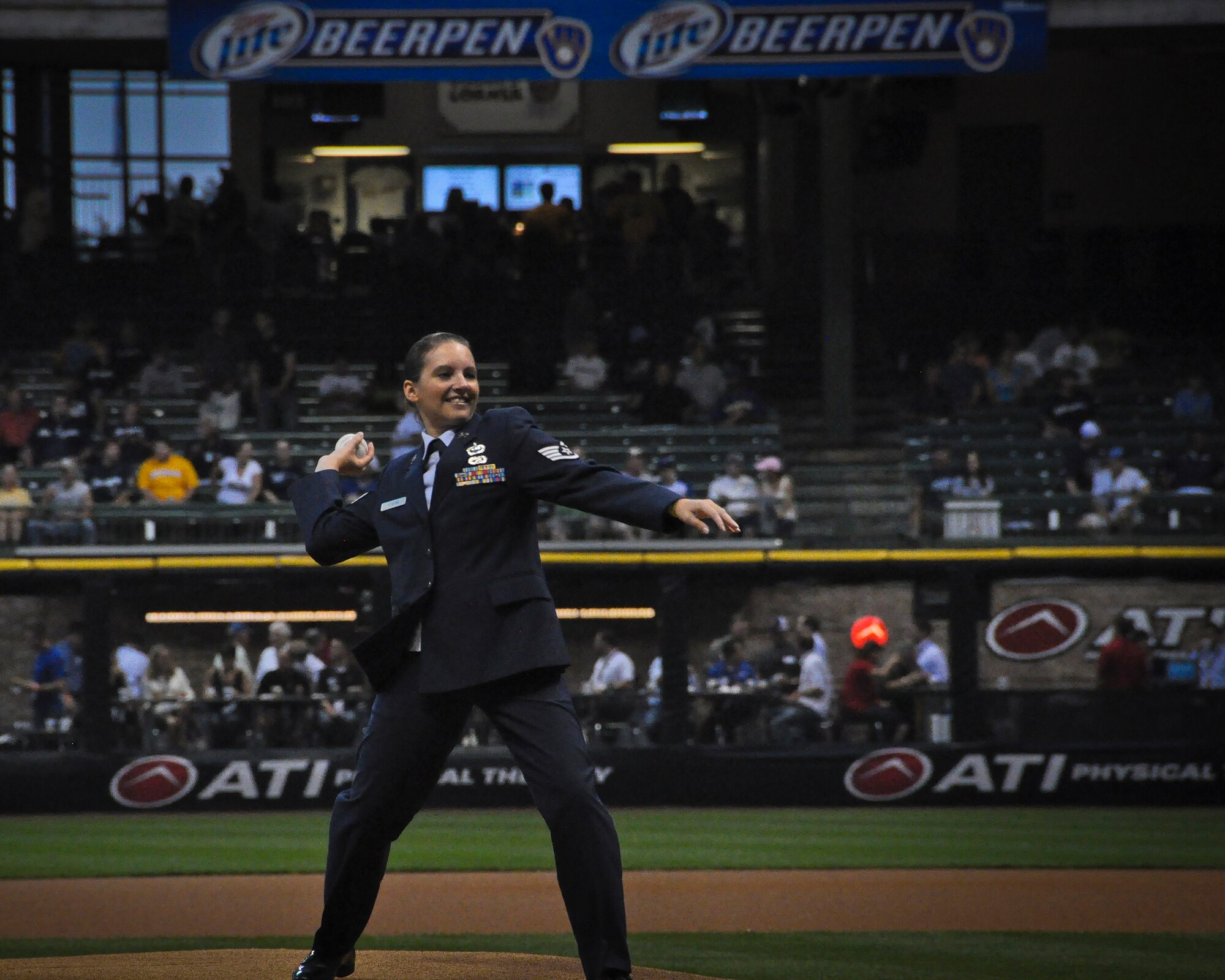 Wisconsin Air National Guardsman Staff Sgt. Leah Rogers throws out the first at Miller Park in Milwaukee Wed., Sept. 12, 2012. 
Rogers, a Financial Management Specialist at the 128th Air Refueling Wing in Milwaukee was selected for the honor in recognition of her recent deployment. (Air National Guard Photo by Staff Sgt. Christopher Wenzel / Released)
