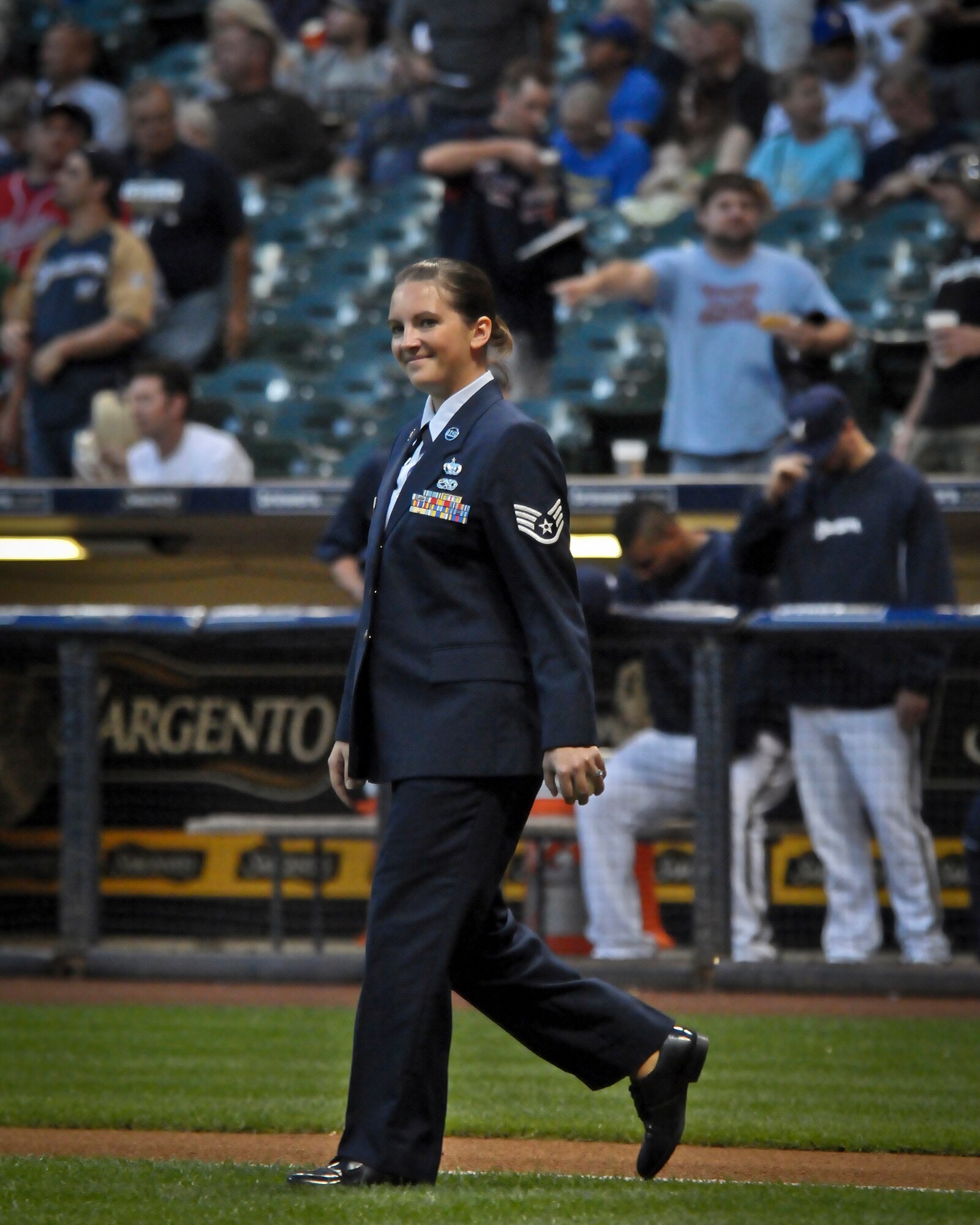 With ball in hand, Staff Sgt. Leah Rogers walks across the infield at Miller Park towards the pitcher’s mound Wed., Sept. 12, 2012. 
Rogers, of the 128th Air Refueling Wing in Milwaukee, was selected to throw out the ceremonial first pitch before the Brewers’ game against the Atlanta Braves. (Air National Guard Photo by 2nd Lt. Nathan Wallin / Released)
