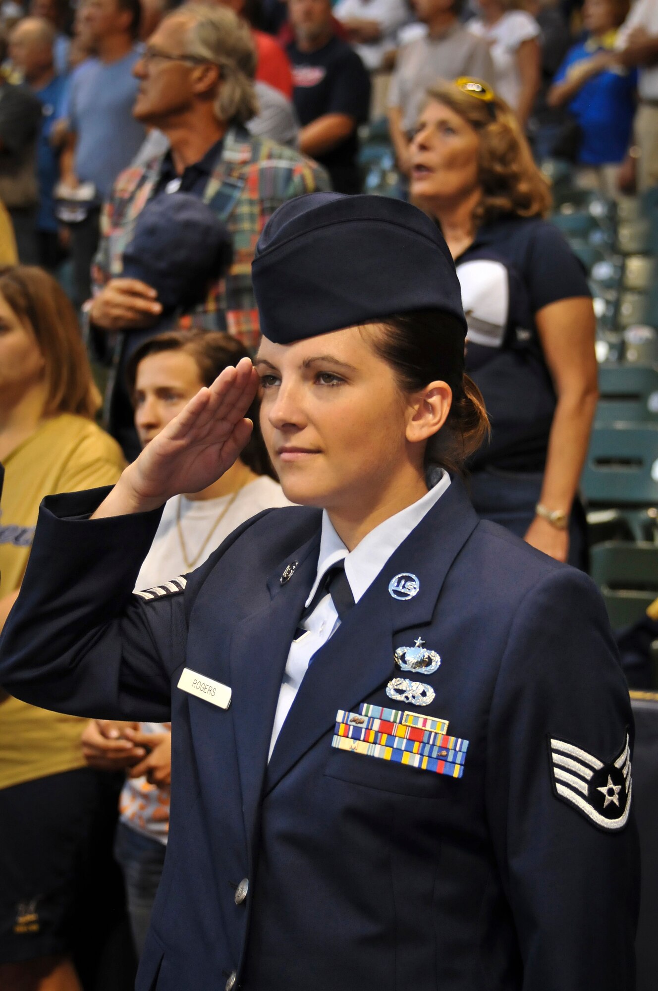 Staff Sgt. Leah Rogers of the 128th Air Refueling Wing renders a salute during the national anthem at Miller Park in Milwaukee Wed., Sept. 12, 2012. 
Rogers was selected to represent Wisconsin Air National Guard unit and throw out the ceremonial first pitch before the Brewers’ game against the Atlanta Braves. (Air National Guard Photo by Staff Sgt. Jeremy M. Wilson / Released)
