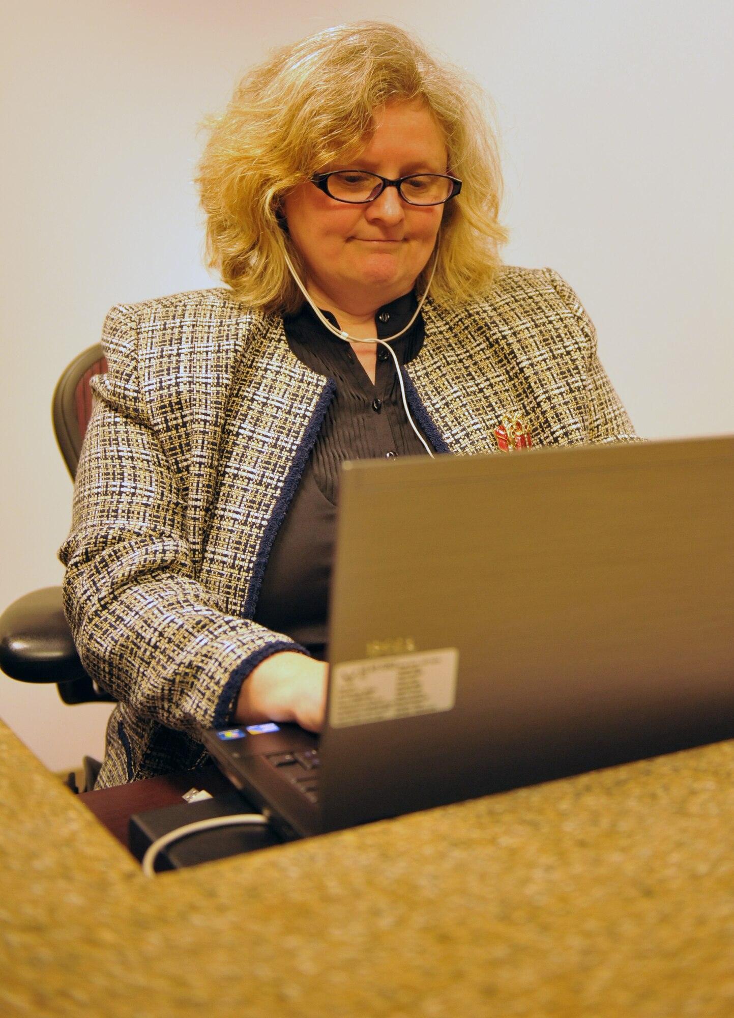 Barbara Lamb, 509th Bomb Wing court reporter, transcribes documents during her shift at the 509th Bomb Wing Legal Office Dec. 3 at Whiteman Air Force Base, Mo. The team works with client concerns and trial preparation and is committed to ensuring customers’ needs are met. (U.S. Air Force photo/Heidi Hunt)