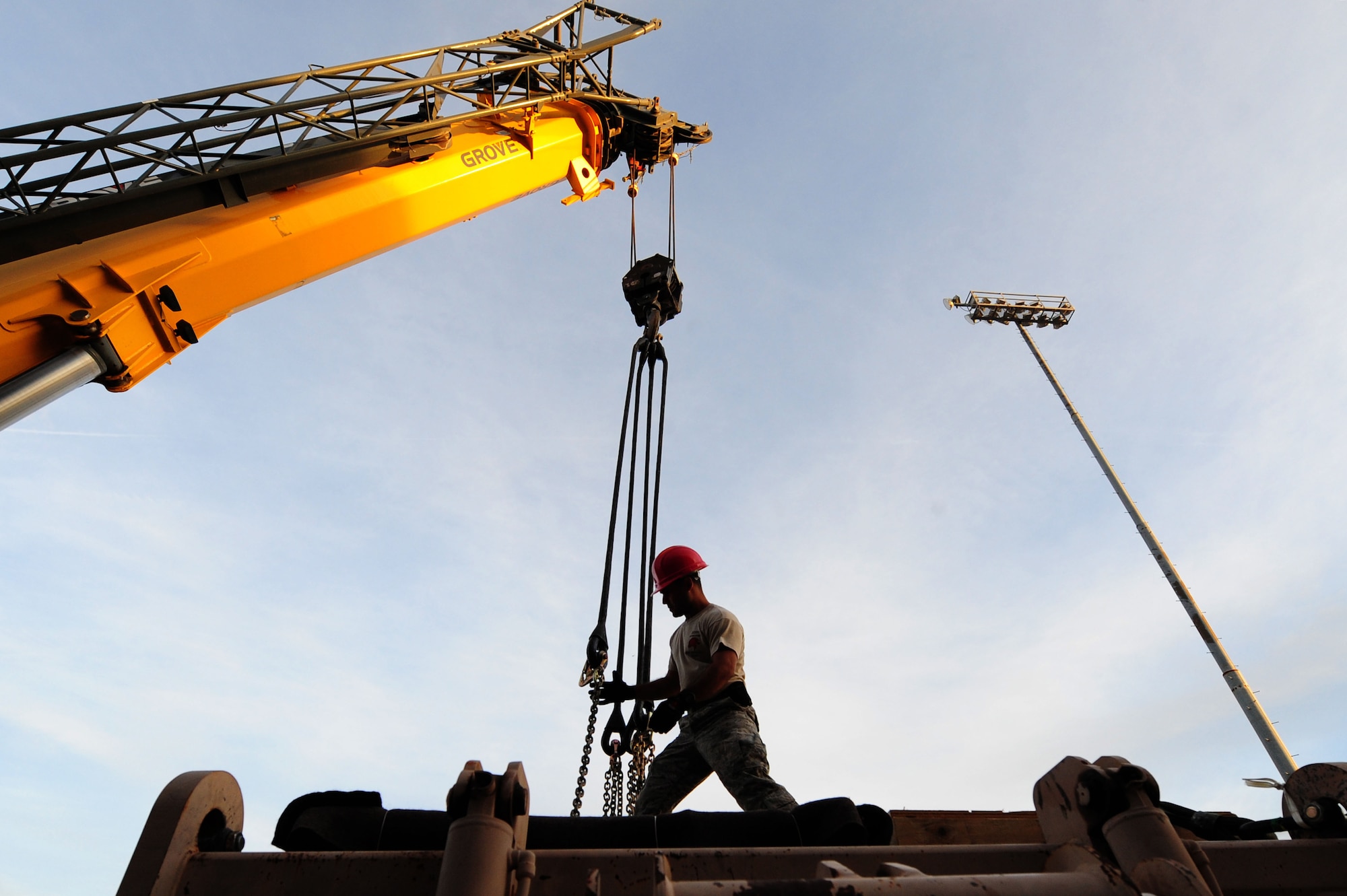 U.S. Air Force Staff Sgt. Armando Irizarry, 820th RED HORSE Squadron airborne electronic systems craftsman, disconnects a crane from heavy equipment Nov. 29, 2012, at Nellis Air Force Base, Nev. The 820th RED HORSE is the only Air Force civil engineer unit with Airborne and Air Assault qualified engineer capabilities with equipment and personnel rigging support, including Explosive Ordnance Disposal, Emergency Management and Fire/Emergency Services personnel. 
(U.S. Air Force photo by Staff Sgt. William P. Coleman)
