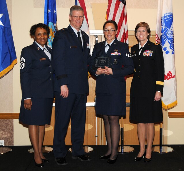 Senior Airman Madeline Carpenter poses with Chief Master Sgt. Tamara Phillips, Command Chief for Ohio Air Natoinal Guard, Brig. Gen. Mark Bartma, Assistant Adjutant General for Air and Maj. Gen. Deborah Ashenhurst, Adjutant General for the state of Ohio at the Ohio Airman of the Year luncheon, Dublin, Ohio, Dec. 1.