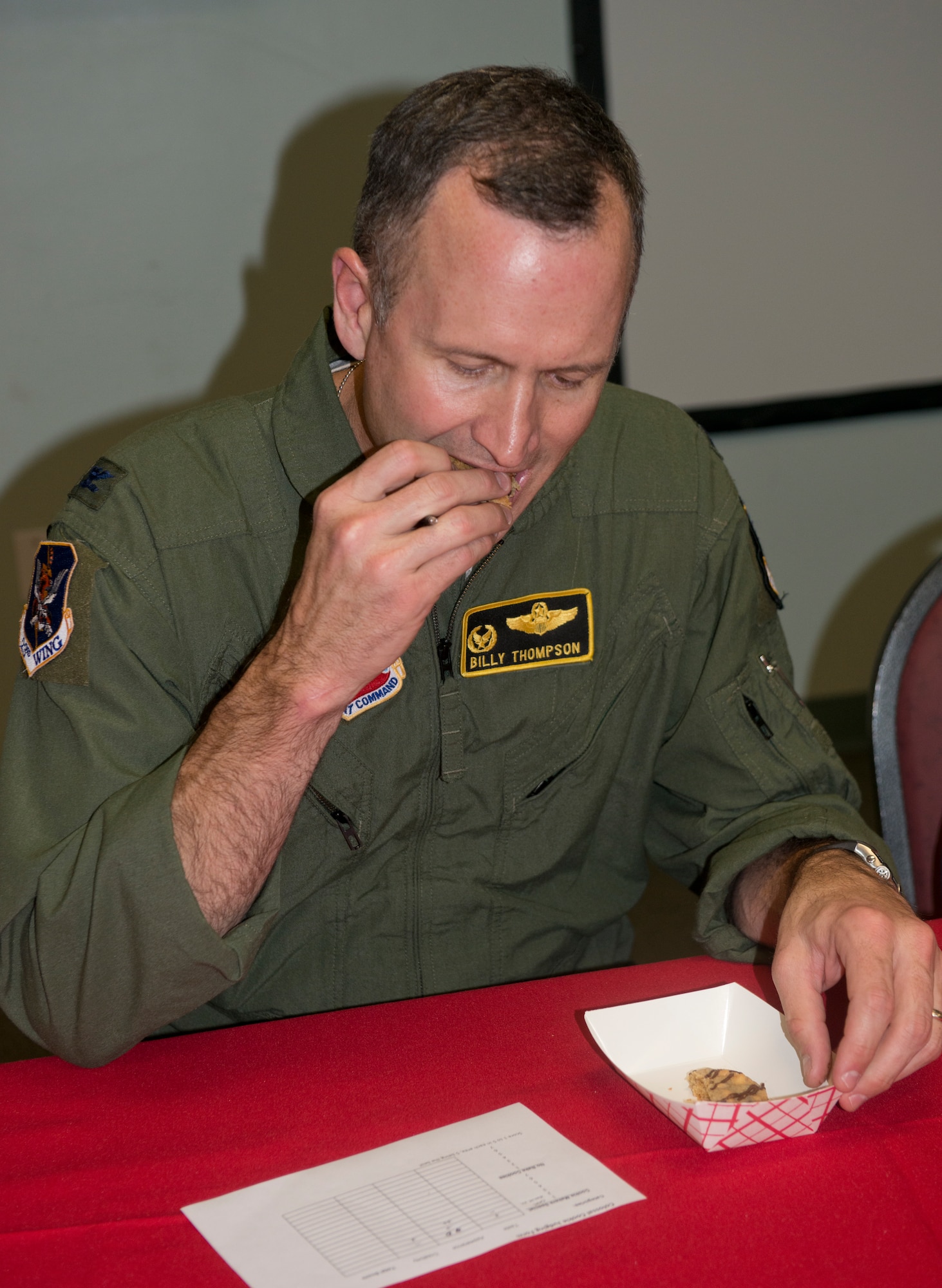 U.S. Air Force Col. Billy Thompson, 23d Wing commander, judges the Colossal Cookie competition at the base chapel, Moody Air Force Base, Ga., Dec. 3, 2012. Thompson was one of three judges who participated in the event to determine the best cookie. The event was in part of the annual Airmen Cookie Drive. (U.S. Air Force photo by Airman 1st Class Paul Francis/Released)
