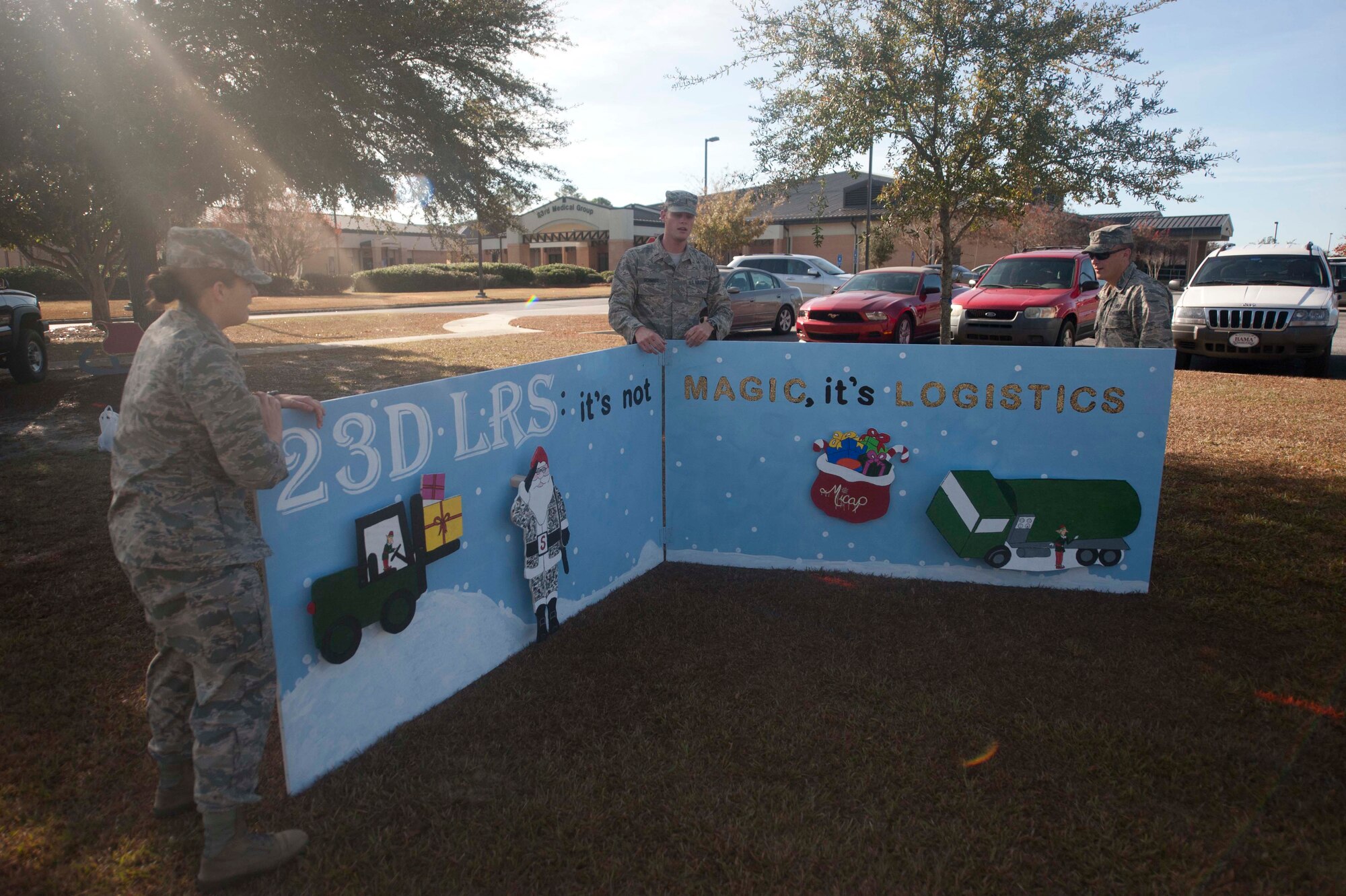 Members from the 23d Logistics Readiness Squadron begin to set up their squadron card at Moody Air Force Base, Ga., Dec 5, 2012.  Nearly 20 units decorated their cards for display outside of the 23d Medical Group. (U.S. Air Force photo by Airman 1st Class Paul Francis/Released)
