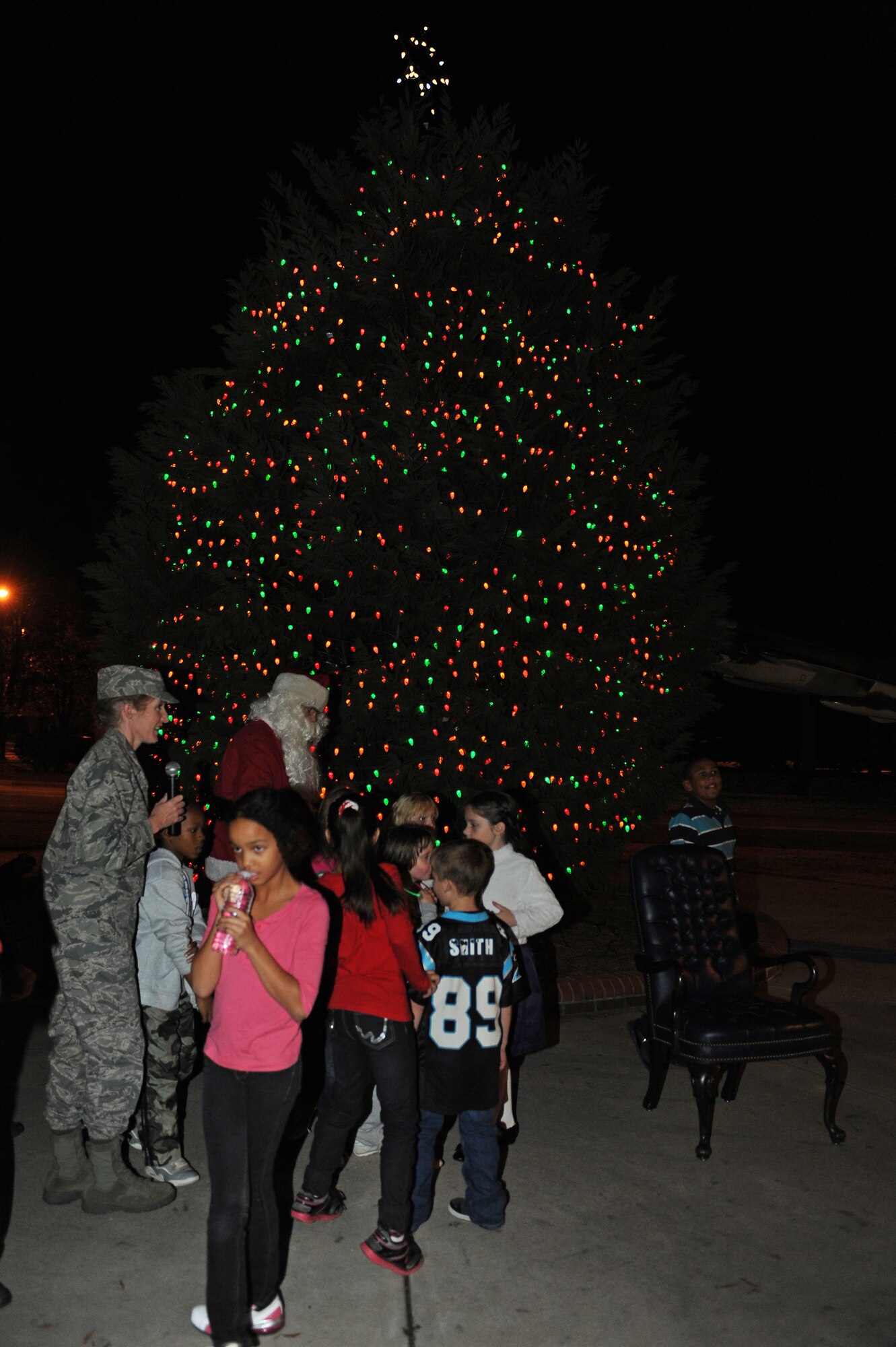 U.S. Air Force Col. Jeannie Leavitt, 4th Fighter Wing commander, Santa Claus and Team Seymour youth watch as the holiday tree lights up on Seymour Johnson Air Force Base, N.C., Dec. 3, 2012. The lighting of the base tree symbolizes the beginning of the holiday season. (U.S. Air Force photo/Airman 1st Class John Nieves Camacho/Released)
