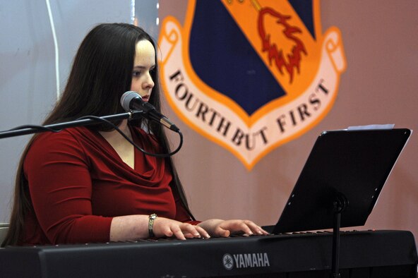 Brianna Buss, 12, plays holiday songs on a piano during the annual base tree lighting ceremony on Seymour Johnson Air Force Base, N.C., Dec. 3, 2012. Additional entertainment was provided by children who attend the base child development and youth centers. Brianna is the daughter of retired Master Sgt. Brian Buss. (U.S. Air Force photo/Airman 1st Class John Nieves Camacho/Released)