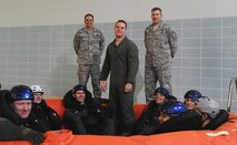 MINOT AIR FORCE BASE, N.D. -- The 5th Bomb Wing SERE (Survival, Evasion, Resistance and Escape) Specialists are responsible for ensuring that all Minot Air Force Base aircrew stay combat mission ready by providing Code of Conduct Continuation Training. These events take place year round and consist of land survival, water survival emergency parachute procedure, and high risk of isolation briefings. Their mission is to ensure that aircrew are ready to Survive Evade Resist and Escape if they ever become isolated. (Photo Courtesy of the Command Chief's Office)