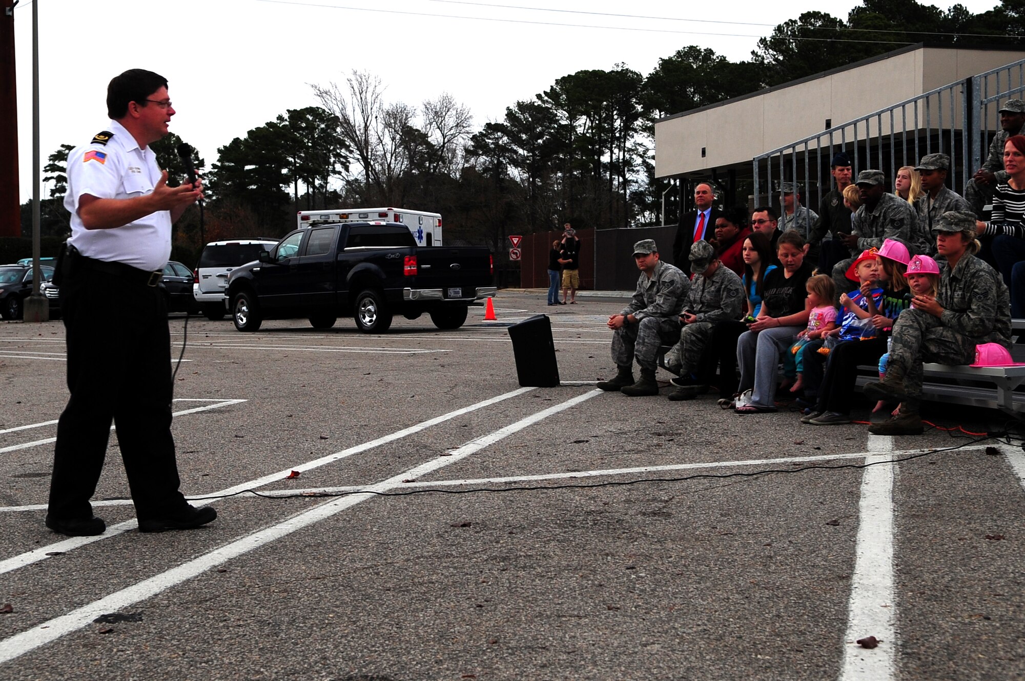 Sean Quinby, 4th Civil Engineer Squadron fire chief, speaks to an audience about holiday safety at the Exchange on Seymour Johnson Air Force Base, N.C., Dec. 5, 2012. Quinby stressed the importance of properly maintaining a Christmas tree in order to prevent house fires. (U.S. Air Force photo/Airman 1st Class Mariah Tolbert/Released)
