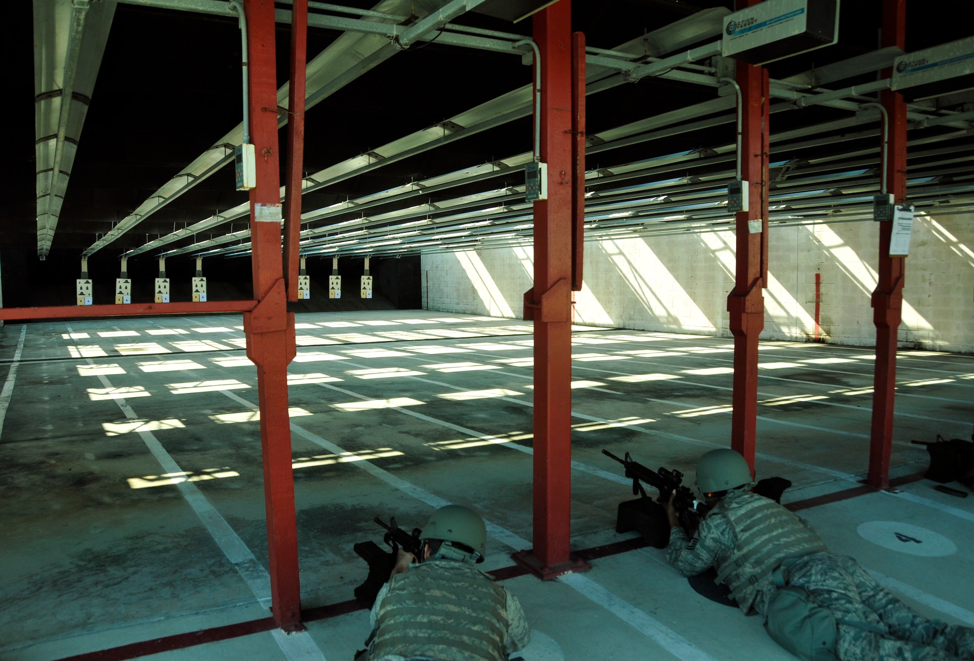 Airmen prepare to fire for their M-4 carbine qualification training at Homestead Air Reserve Base’s Combat Arms Training and Maintenance range, Dec. 1. Airmen are scheduled to qualify within the 90 days prior to a deployment or annually, depending on their job, to stay within Air Force regulations. During an evaluation for the M-4, Airmen must hit the target on 17 of 24 rounds to qualify. All told, Airmen fire 192 rounds, to include both practice and evaluation rounds. (U.S. Air Force photo/Senior Airman Jacob Jimenez)