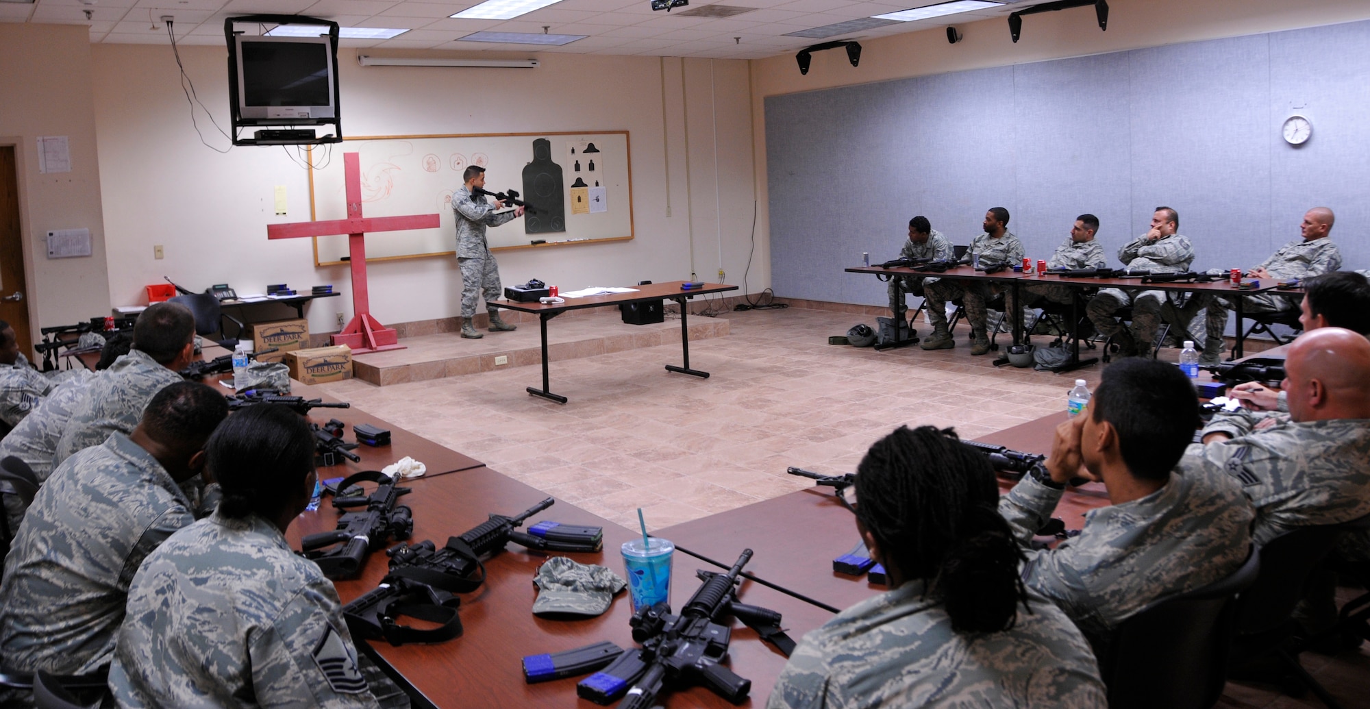 Senior Airman Matthew Dickson, 482nd Security Forces Squadron Combat Arms Training and Maintenance instructor, teaches a class on the M-4 carbine at Homestead Air Reserve Base’s CATM range, Dec. 1. Airmen are scheduled to qualify within the 90 days prior to a deployment or annually, depending on their job, to stay within Air Force regulations. During an evaluation for the M-4, Airmen must hit the target on 17 of 24 rounds to qualify. All told, Airmen fire 192 rounds, to include both practice and evaluation rounds. (U.S. Air Force photo/Senior Airman Jacob Jimenez)