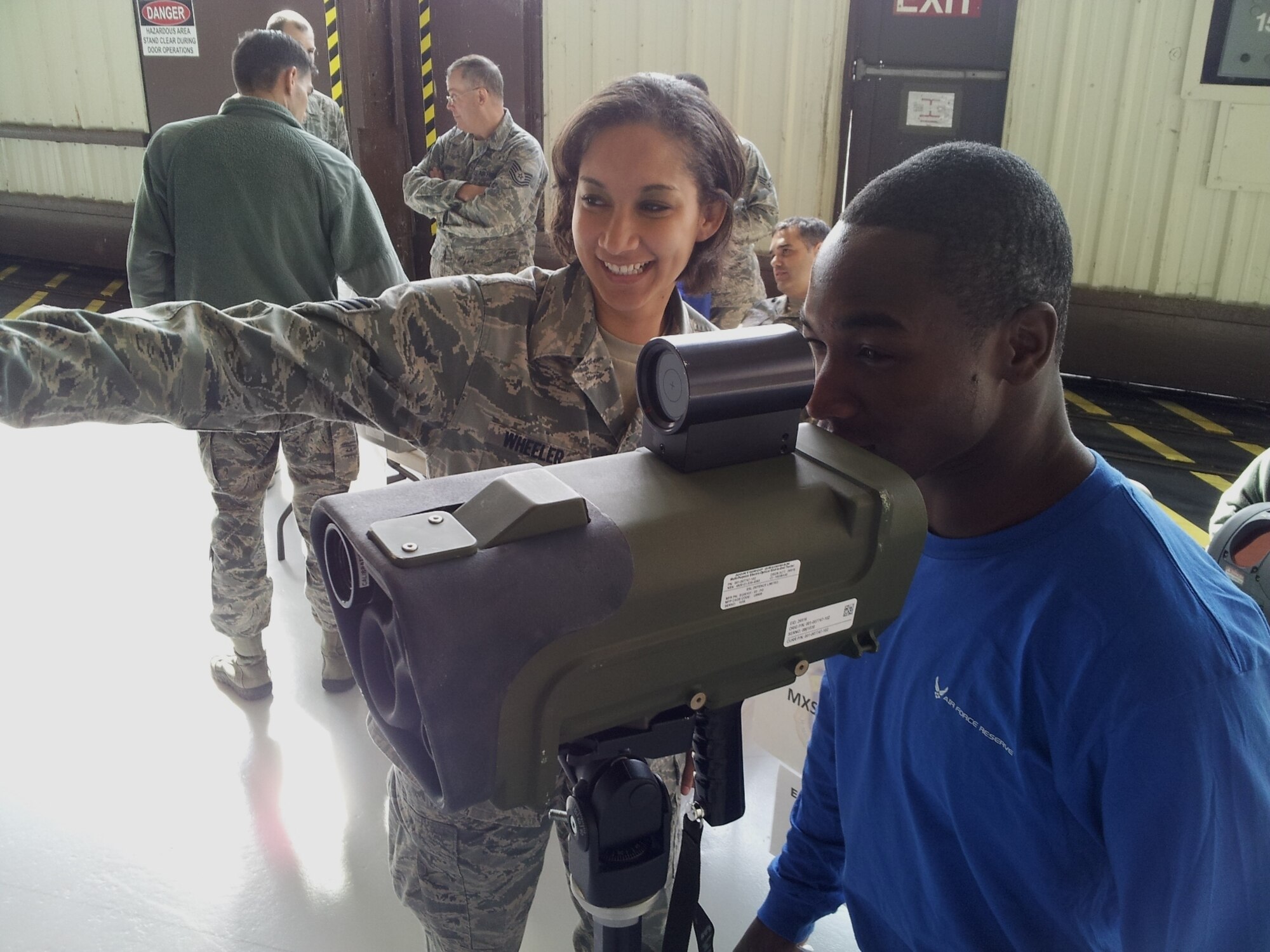 Senior Airmen Courtney Wheeler, 440th Maintenance Squadron, explains to Rodrick Smith, an Air Force Reserve trainee, the Large Aircraft Infrared Countermeasures system.  Smith is scheduled to attend basic military training in early January.  Career and Diversity Day was an opportunity for Airmen across Pope Field to learn about career fields from across Pope Field and speak with Airmen in those career fields.  (US Air Force photo by Master Sgt. Steve Staedler, 440 AW/PA)