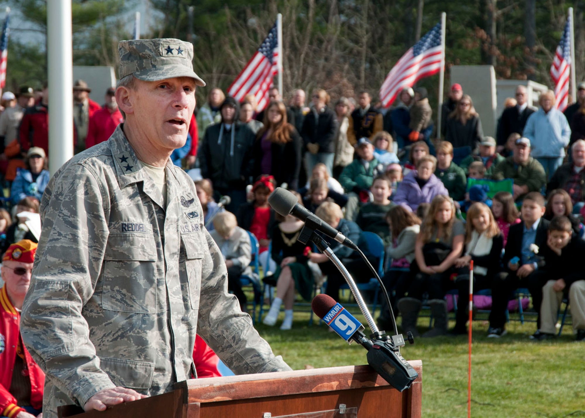 BOSCAWEN, N.H. -- Maj. Gen. William N. Reddel, The Adjutant General, State of New Hampshire, delivers his welcoming remarks to visitors during the Veteran's Day Ceremony at the N.H. State Veterans Cemetary Nov. 11. The commander highlighted members of the New Hampshire national Guard who are deployed or will soon be deployed. (National Guard photo by Tech. Sgt. Mark Wyatt/RELEASED)