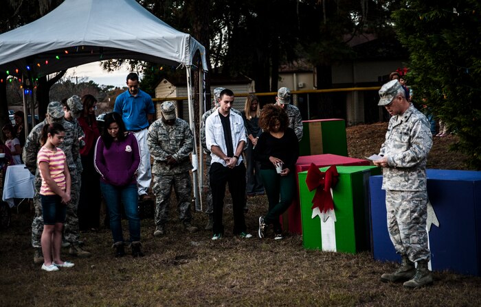 Chaplain (Lt. Col.) Michael Brown, 628th Air Base Wing chaplain, gives the invocation at the 2012 Joint Base Charleston – Air Base Tree Lighting ceremony Dec. 5, 2012. The ceremony included a visit from Santa Claus and the announcement of the Air Base Holiday Card Contest winner. (U.S. Air Force photo/ Senior Airman Dennis Sloan)
