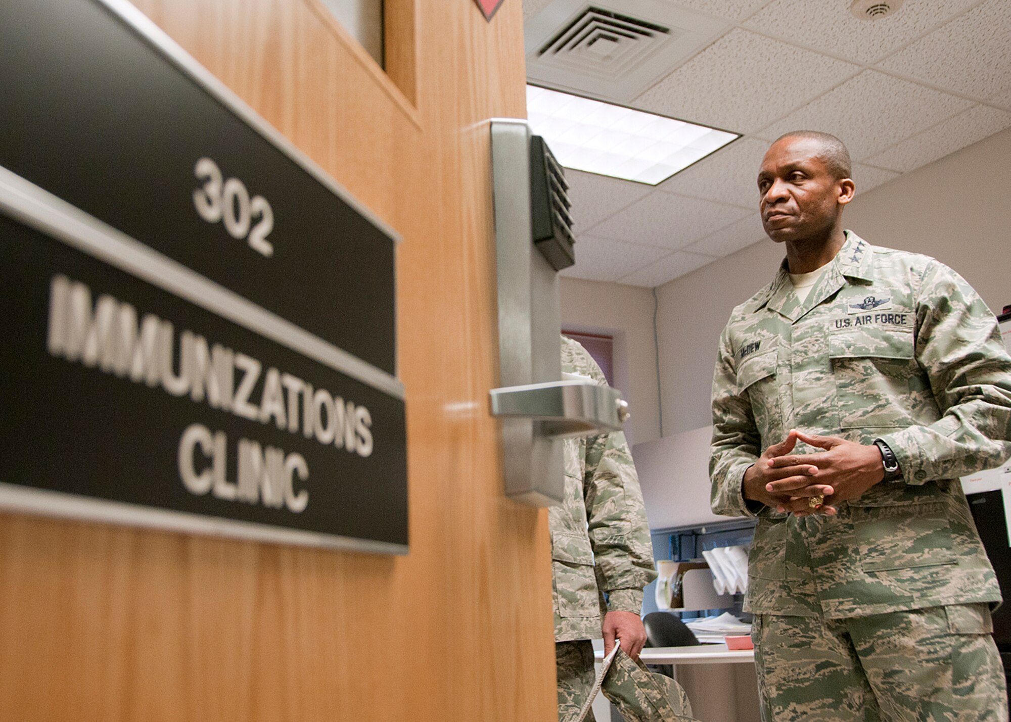 PEASE AIR NATIONAL GUARD BASE, Mass. -- Lt. Gen. Darren McDew, 18th Air Force commander, visits the Immunizations Clinic during a visit to 157th Medical Group Dec. 4. The general visited here to meet with Airmen and see first-hand the impact Total Force Integration is having on the mission of the New Hampshire Air National Guard. (National Guard photo by Tech. Sgt. Mark Wyatt/RELEASED)