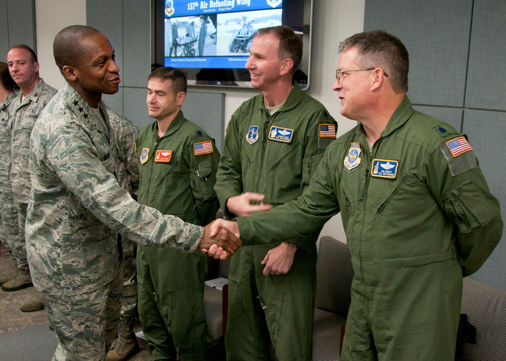 PEASE AIR NATIONAL GUARD BASE, Mass. -- Lt. Gen. Darren McDew, 18th Air Force commander, greets Lt. Col. James Ryan and Lt. Col. Tim Graff among others during a visit to Building 100 Dec. 4. The general visited here to meet with Airmen and see first-hand the impact Total Force Integration is having on the mission of the New Hampshire Air National Guard. (National Guard photo by Tech. Sgt. Mark Wyatt/RELEASED)