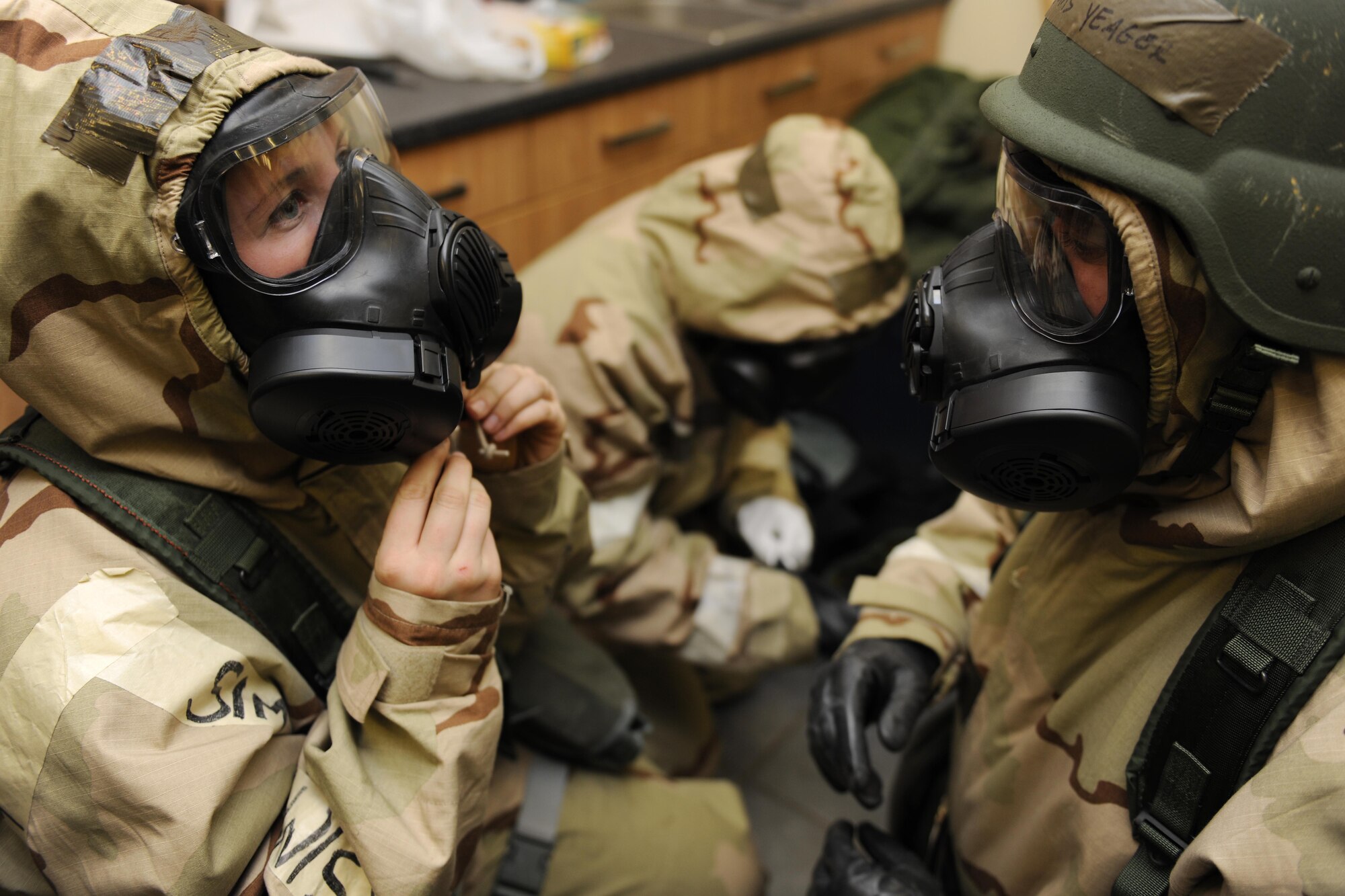 ROYAL AIR FORCE LAKENHEATH, England -- Airmen from the 48th Component Maintenance Squadron perform "buddy checks" during a Phase II Exercise Dec. 5, 2012. The week-long exercise tested combat sortie capabilities of the 48th Fighter Wing to support a NATO contingency operation. (U.S. Air Force photo by Senior Airman Lausanne Morgan)