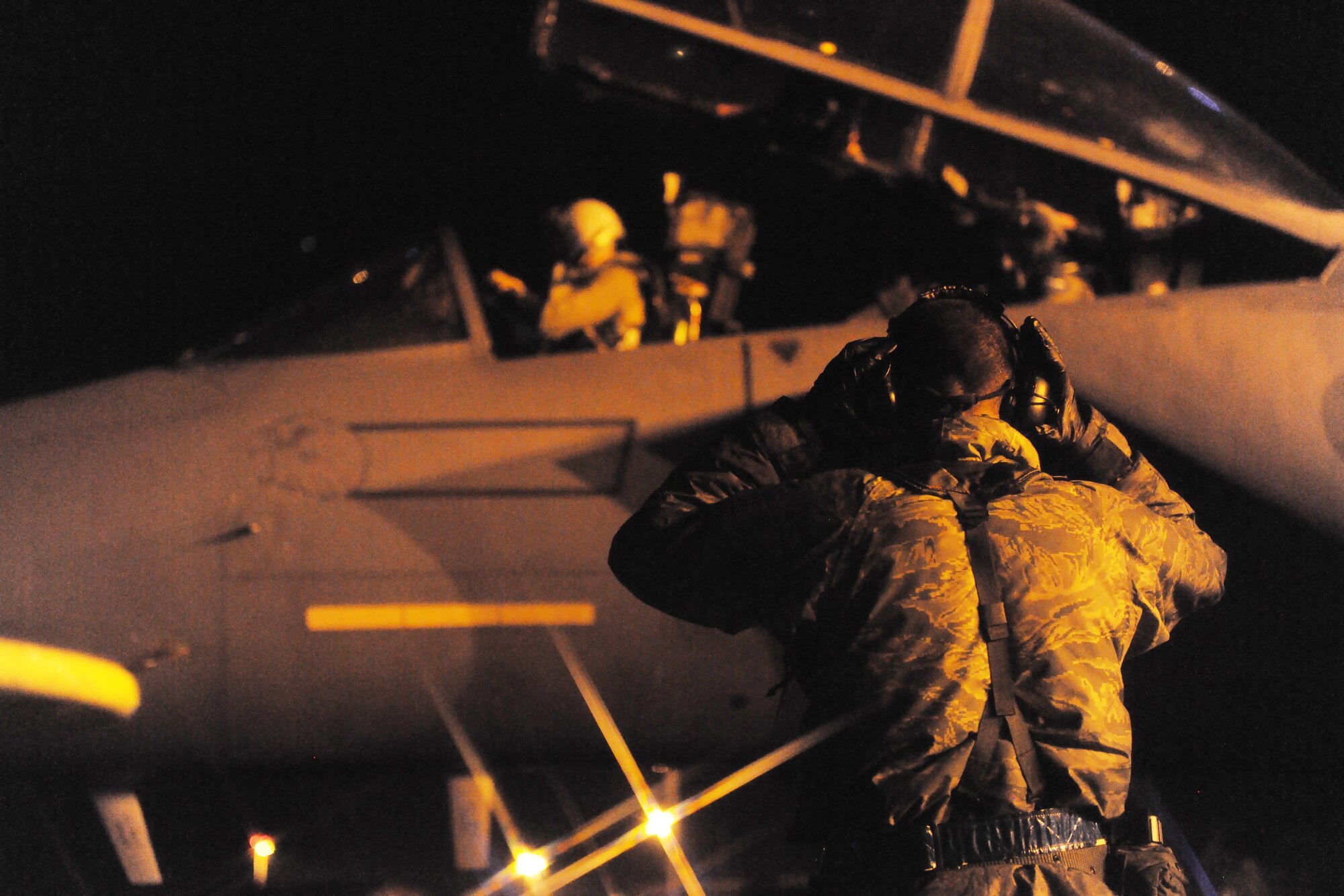 ROYAL AIR FORCE LAKENHEATH, England -- A crew chief from the 48th Aircraft Maintenance Squadron performs preflight checks on an F-15E Strike Eagle during a Phase II Exercise Dec. 4, 2012. The week-long exercise tested combat sortie capabilities of the 48th Fighter Wing to support a NATO contingency operation. (U.S. Air Force photo by Senior Airman Lausanne Morgan)