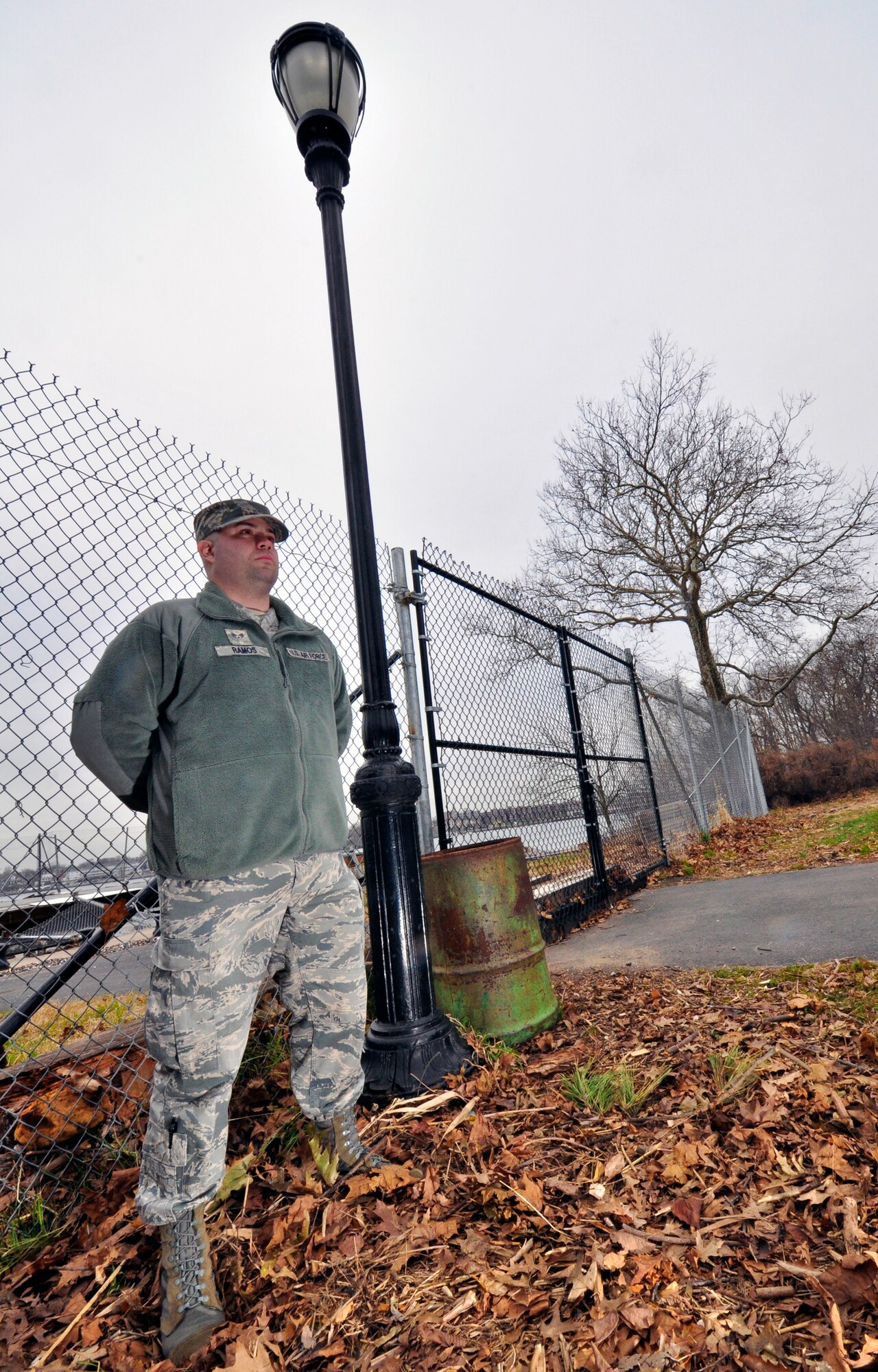 Senior Airman Isac Ramos, 514th Operations Support Squadron, visited the Conference House Park in Staten Island, N.Y., Dec. 1. Ramos, an officer with the New York Police Department, patrolled the area near the park during Hurricane Sandy. Ramos watched from a nearby hilltop as the pictured lamp post was totally submerged by floodwaters. (U.S. Air Force photo by Shawn J. Jones)