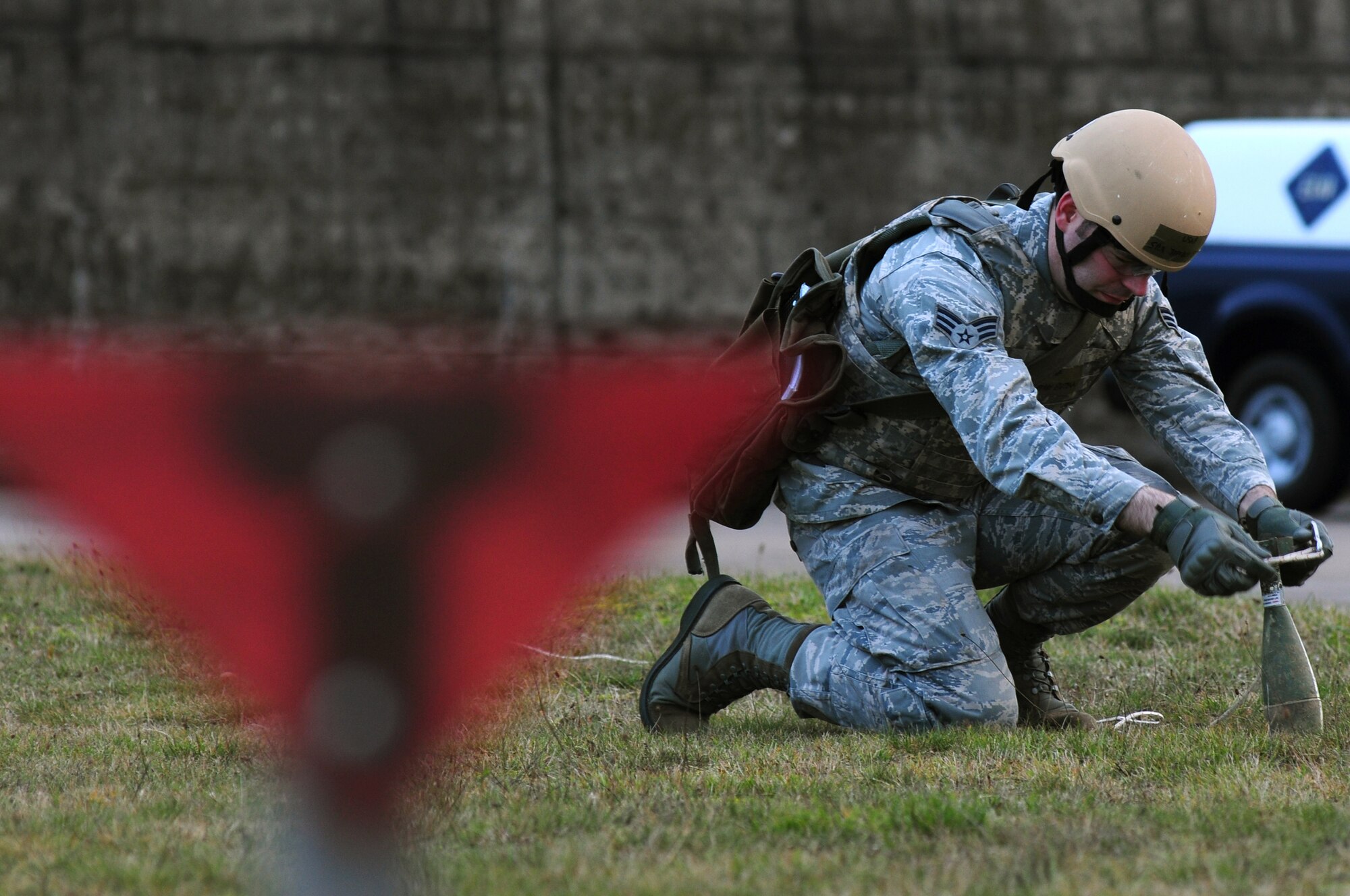 ROYAL AIR FORCE LAKENHEATH, England – Senior Airman Jeffrey Butera, 48th Civil Engineer Squadron explosive ordnance disposal technician, performs an initial inspection of an unexploded ordnance during a Phase II Exercise Dec. 5, 2012. The week-long exercise tested 48th Fighter Wing readiness to support NATO contingency operations. (U.S. Air Force photo by Airman 1st Class Cory D. Payne)