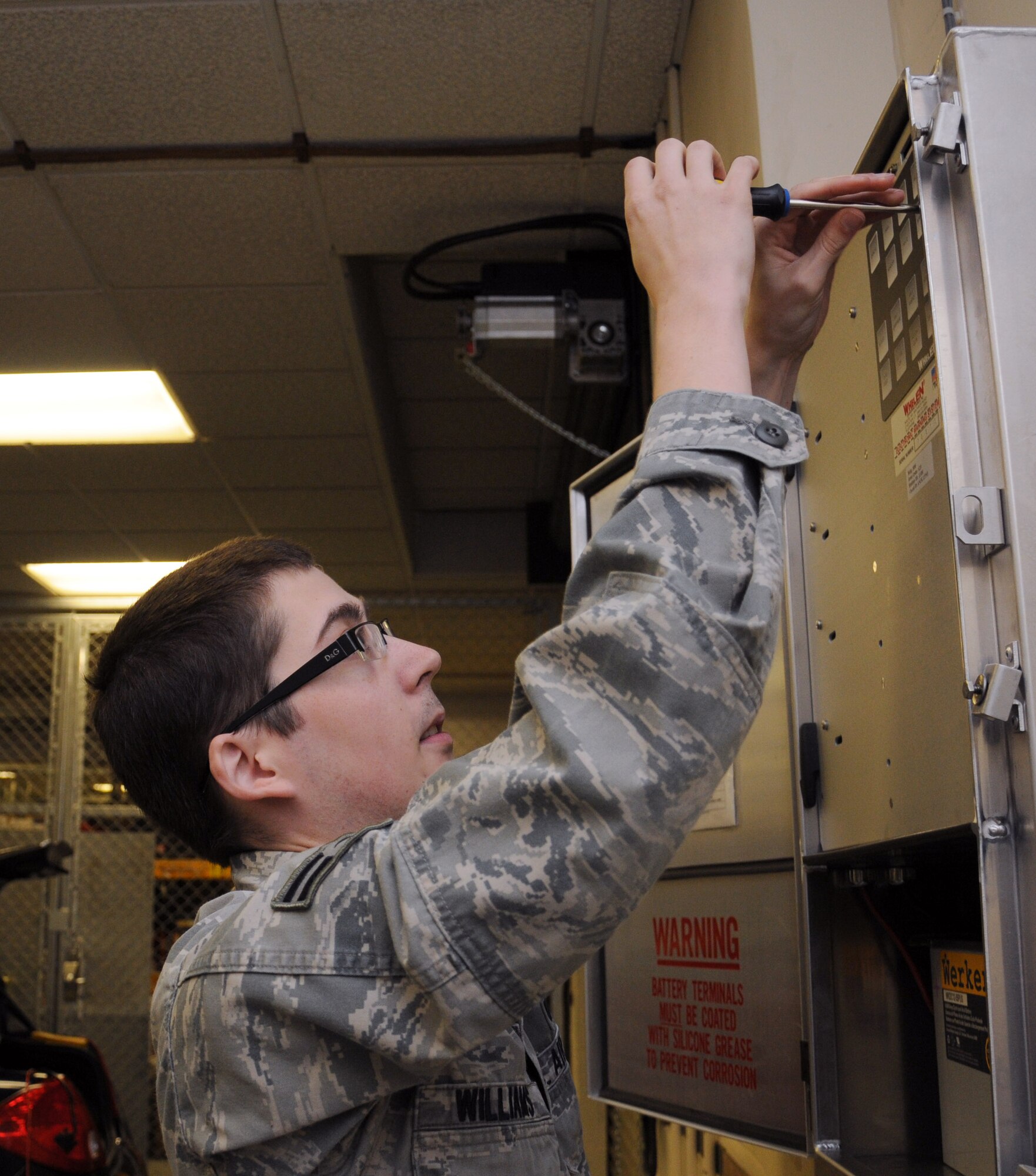 Airman 1st Class Weston Williams, 100th Communications Squadron transmissions system journeyman from Allen, Texas, performs an operations check on the mass alert notification system Dec. 5, 2012, at RAF Mildenhall, England. Airmen assigned to the transmissions systems section of the 100th CS are responsible for all radio communication and mass alert systems on base. (U.S. Air Force photo by Gina Randall/Released)