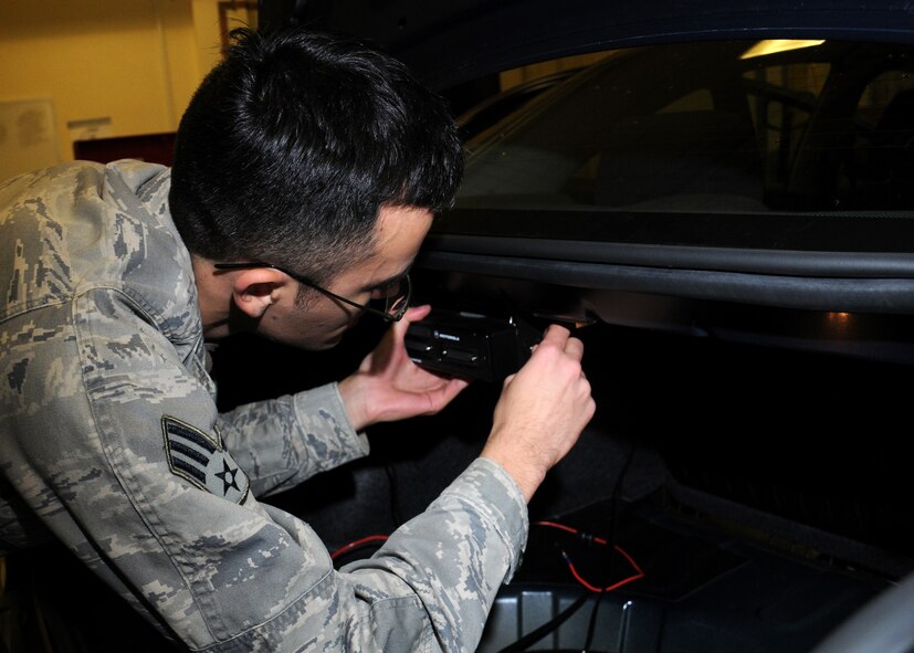 Senior Airman Nicholas Resley, 100th Communications Squadron transmissions system journeyman from Detroit, Mich., installs a radio into a government vehicle Dec. 5, 2012, at RAF Mildenhall, England. Airmen from the transmissions system section are responsible for installing and maintaining all radios in government vehicles.  (U.S. Air Force photo by Gina Randall/Released)