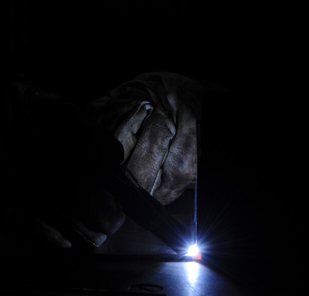 U.S. Air Force Col. Brian McDaniel, 18th Wing vice commander, performs a tungsten-electrode inert gas welding technique on Kadena Air Base, Japan, Dec. 6, 2012. TIG is a slower welding technique, but the quality of weld tends to be cosmetically better because there is no weld spatter and it has a clean finish, according to Senior Master Sgt. Roger Starcher, 18th EMS Fabrication Flight superintendant. During his visit to the 18th Equipment Maintenance Squadron, Airmen taught the commander how to do specific welding techniques. McDaniel said he wanted to learn how to weld because his father used to weld and would always boast about how good he was, so he wanted to try it out himself to show that he could do it too. (U.S. Air Force photo/Airman 1st Class Justin Veazie)