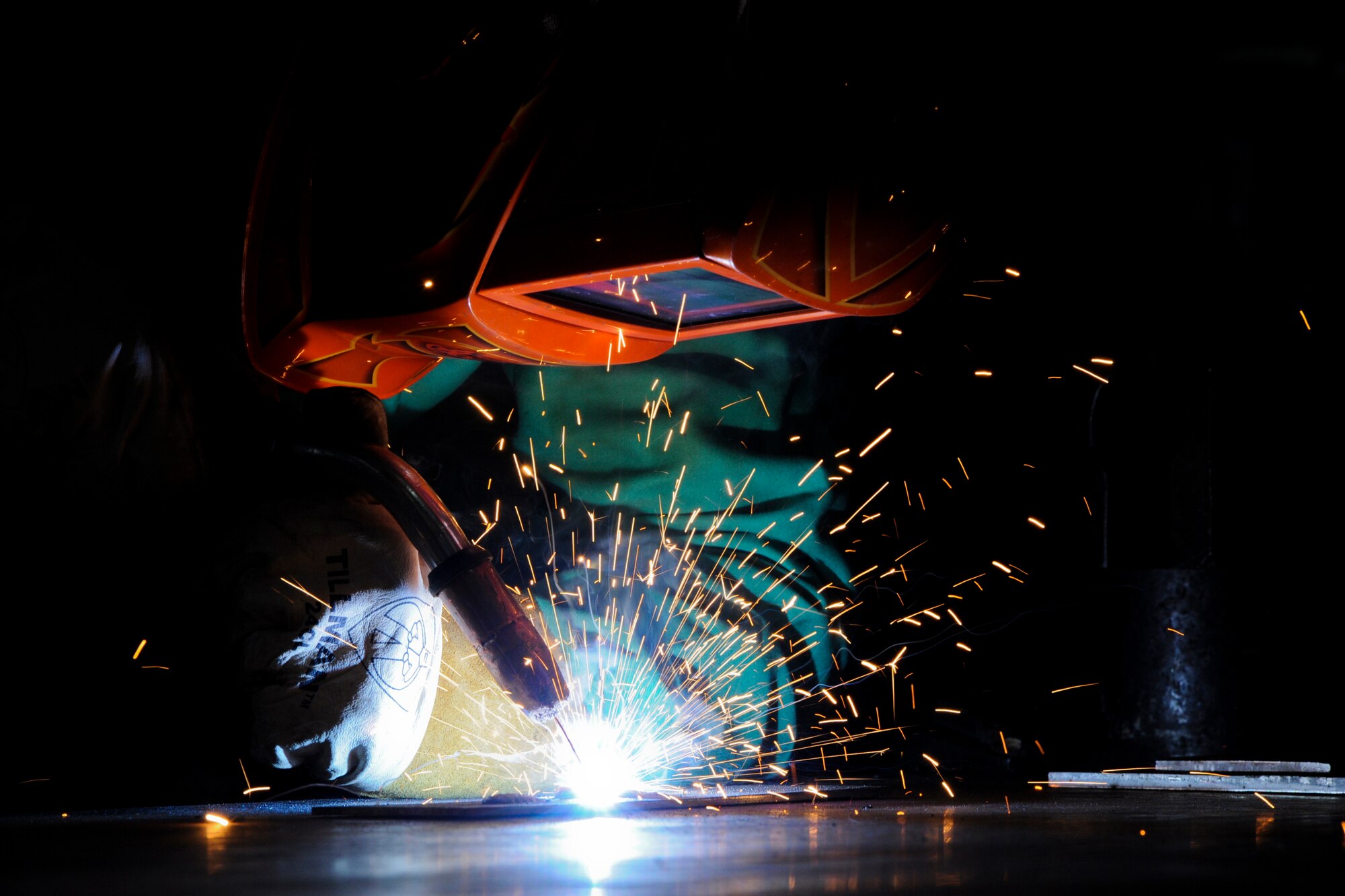 U.S. Air Force Col. Brian McDaniel, 18th Wing vice commander, practices a metal inert gas welding technique on training materials on Kadena Air Base, Japan, Dec. 6, 2012. During his visit to the 18th Equipment Maintenance Squadron, Airmen taught the commander how to do specific welding techniques. McDaniel said he wanted to learn how to weld because his father used to weld and would always boast about how good he was, so he wanted to try it out himself to show that he could do it too. (U.S. Air Force photo/Airman 1st Class Justin Veazie)