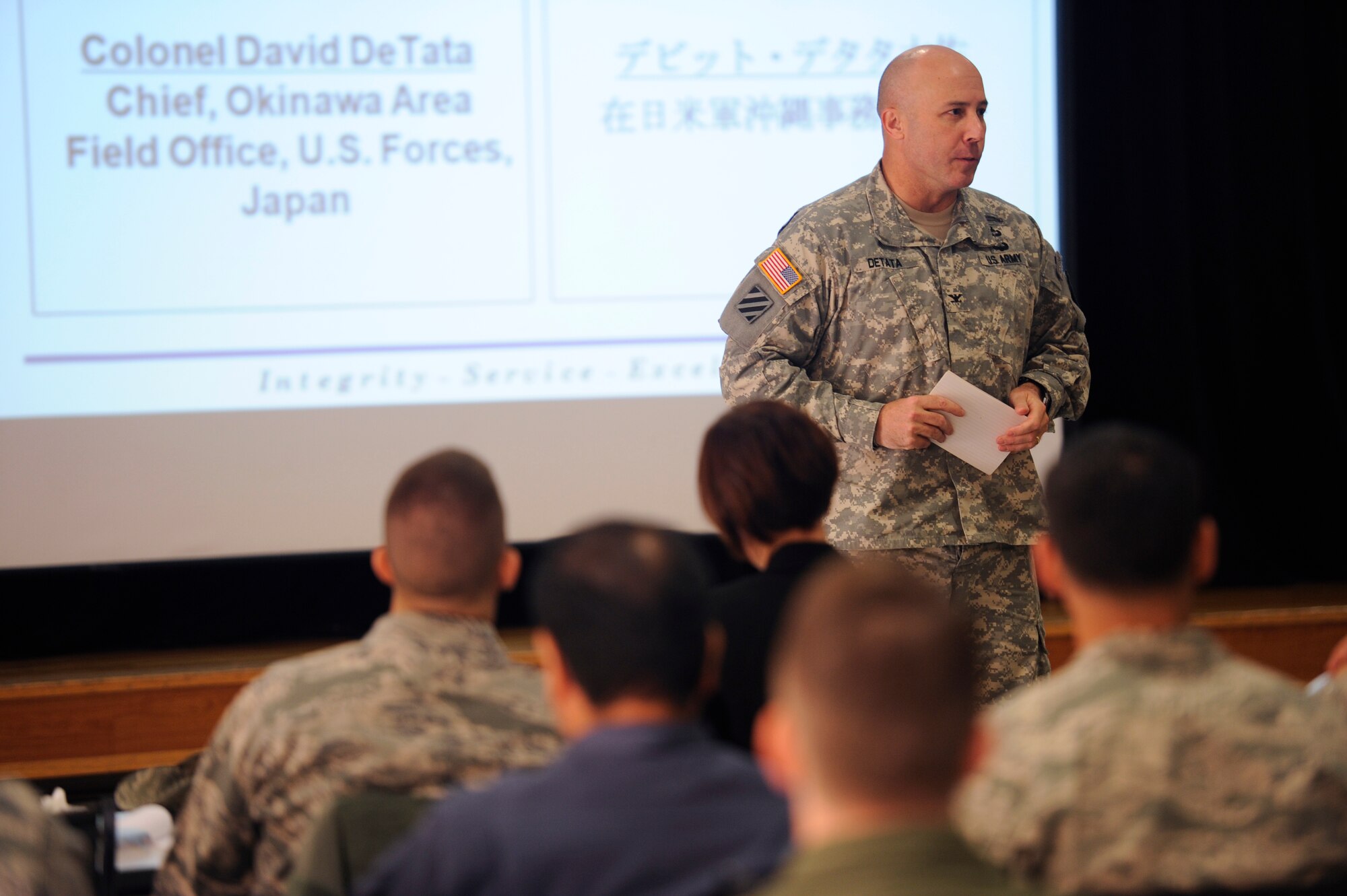 U.S. Army Col. David DeTata, U.S. Forces, Japan's Okinawa Area Field Office chief, makes an opening statement during the joint table-top exercise at the Schilling Community Center on Kadena Air Base, Japan, Dec. 4, 2012. During the exercise, participants simulated a U.S. military aircraft crash in Okinawa city and discussed civilian injuries, the notification system and rescue activities. Roughly 70 people, including officials from the Okinawa Prefectural Police, Okinawa City Fire Department and all U.S. military Services participated in the training. (U.S. Air Force photo/Senior Airman Maeson L. Elleman/released)