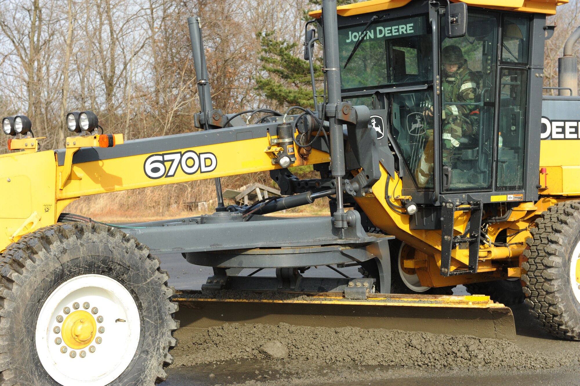 U.S. Air Force Staff Sgt. Joseph Roach, 35th Civil Engineer Squadron pavement and construction equipment operator, clears debris from a simulated missile impact crater with a front end loader , Dec. 5, 2012, during an Operation Readiness Exercise at Misawa Air Base, Japan.  The mock runway area on Security Hill gives the Airmen from the airfield damage repair flight the ability to practice their craft without damaging the active runway or taxiways. (U.S. Air Force by Staff Sgt. Jess Lockoski)