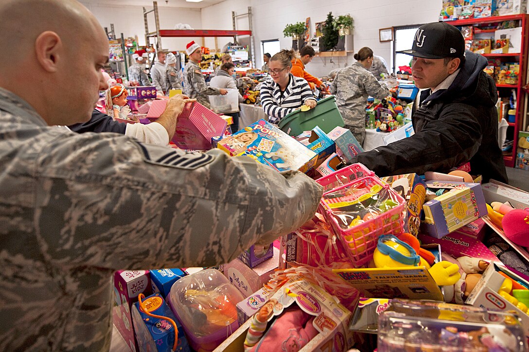 Air Force Airman’s Attic volunteers help parents find toys during the 9th annual toy distribution on Eglin Air Force Base, Fla., Nov. 29, 2012. More than 6,000 toys, collected by donations made throughout the year, were distributed to active-military families in need of assistance during the holidays.