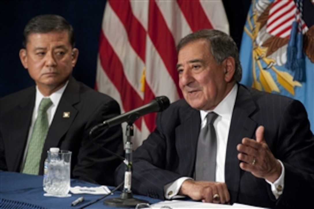 Secretary of Defense Leon E. Panetta, right, answers a reporter's question during a joint press conference with Secretary of Veterans Affairs Eric Shinseki at the Department of Veterans Affairs building in Washington, D.C., on Dec. 6, 2012.  Panetta and Shinseki met prior to the press conference to discuss ways to help facilitate veteran disability claims as well as the new transition assistance programs.  