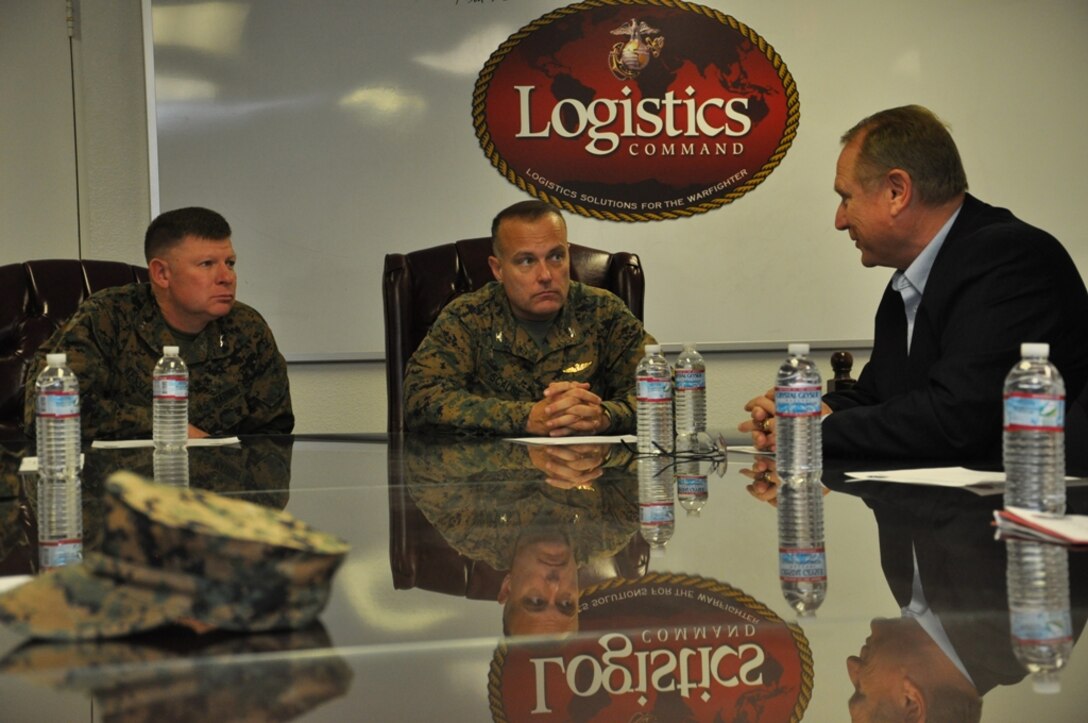 Major General James Kessler, commanding general of Marine Corps Installations Command (left) speaks with 
Col. Michael L. Scalise, commanding officer of Marine Corps Logistics Base Barstow and Patrick Shimko, 
Plant Manager of Production Plant Barstow aboard MCLB Barstow Dec. 6. During Kessler's visit to MCLB Barstow,
 he visited with departments and spoke with members of the base community. 