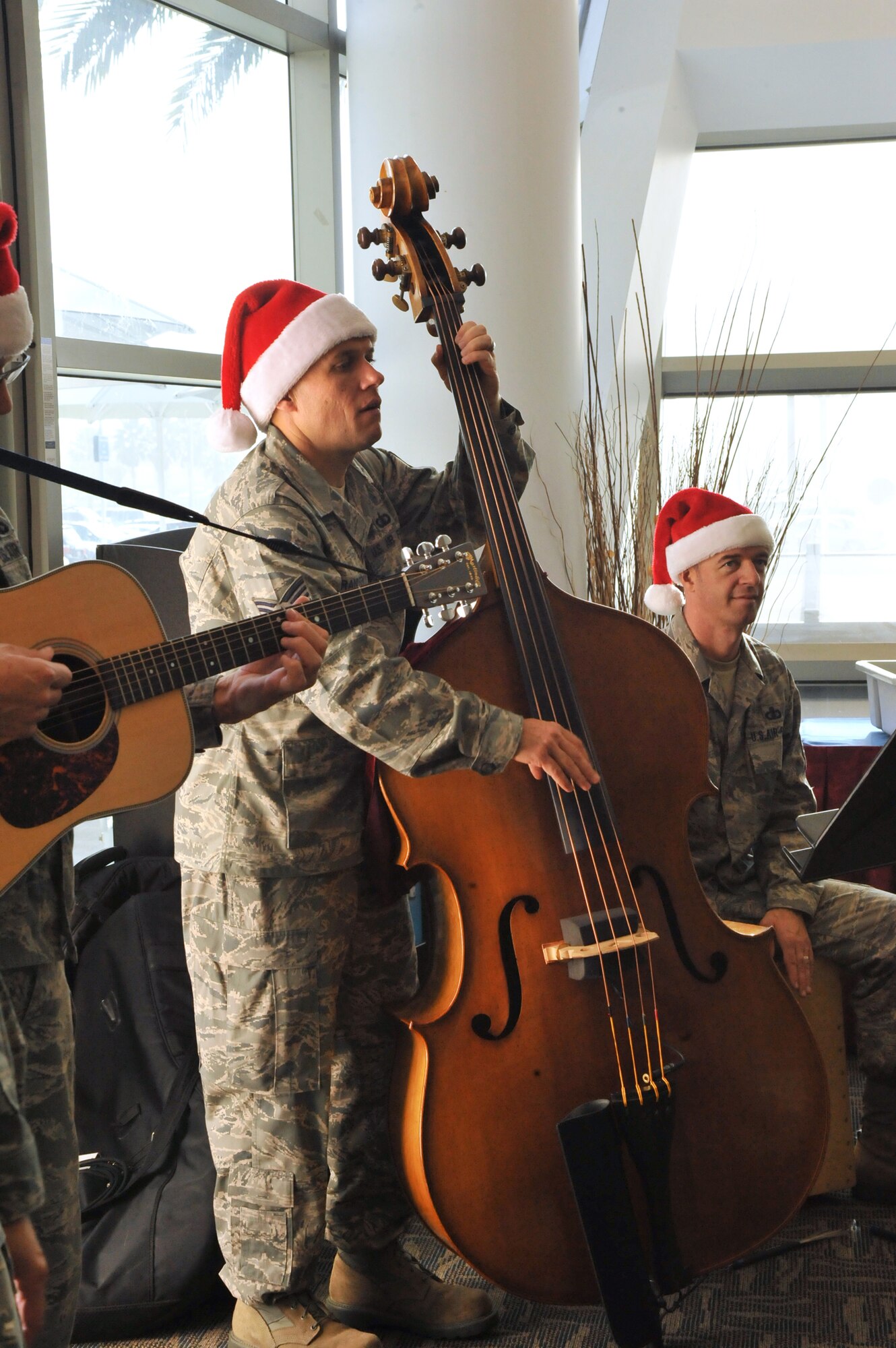 Holiday carolers from the Band of the Golden West perform at the Los Angeles AFB Club during the group’s annual holiday tour of installations in their operating area, Dec. 7. (Photo by Sarah Corrice)