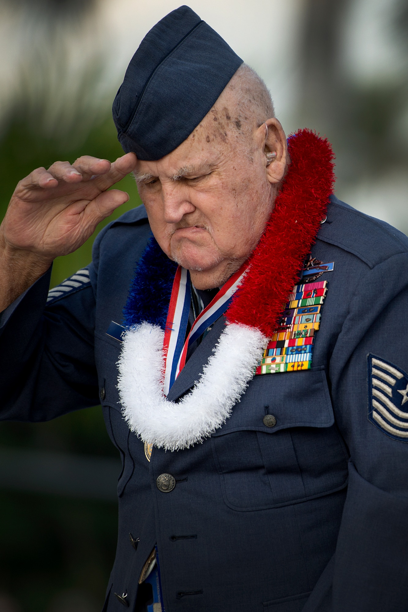 Master Sgt. (Ret.) Ken Ford, a Hickam Field survivor of the Dec. 7, 1941, attacks, salutes during the Nation Anthem at the 71st Remembrance Ceremony only a few yards away from where he was when the Japanese began their attacks on Hickam Field, Joint Base Pearl Harbor-Hickam, Hawaii, Dec. 7, 2012. The remembrance ceremony hailed and commemorated the actions of the service members and civilians that responded to the attacks, many giving their lives in the line of fire for their country. Hickam Filed lost 189 Airmen and civilians while more than 300 were wounded. Ford served in WWII, Korea War and in Vietnam during his 26-year military career. (U.S. Air Force photo/Staff Sgt. Mike Meares)