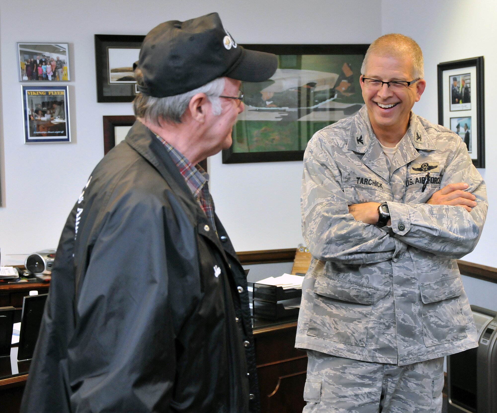 Bob Humphries, Georgia Vietnam Veterans Alliance vice president, and Col. Timothy Tarchick, 94th Airlift Wing commander, discuss how the military has evolved through the years. The GVVA presented gift cards that will be used to help, not only Airmen, but also Marines, Soldiers and Sailors around Dobbins Air Reserve Base in need during the holiday season. (U.S. Air Force photo/Senior Airman Elizabeth Van Patten)