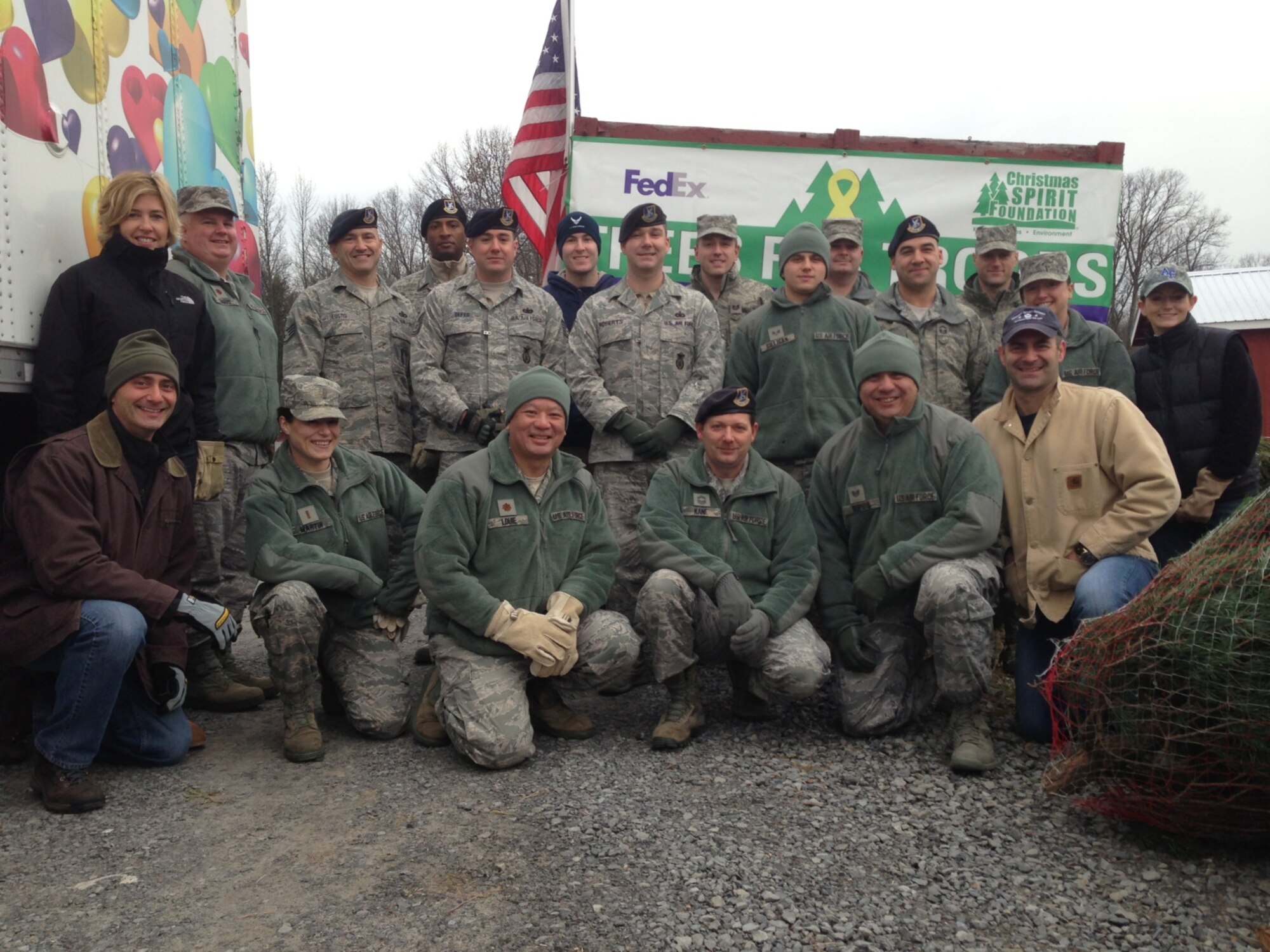 BALLSTON SPA, N.Y. -- New York Air National Guard members of the 109th Airlift Wing from Scotia, N.Y. volunteered their time to assist FedEx driver Don Pelletier load Christmas Trees here at Ellms Christmas Tree Farm Dec. 7. Nineteen Airmen volunteered to assist in the annual "Trees for Troops" loading of about 150 donated trees bound for military installations and families around the country and the globe. Courtesy photo by Chip Ellms, Ellms Christmas Tree Farm. (RELEASED)