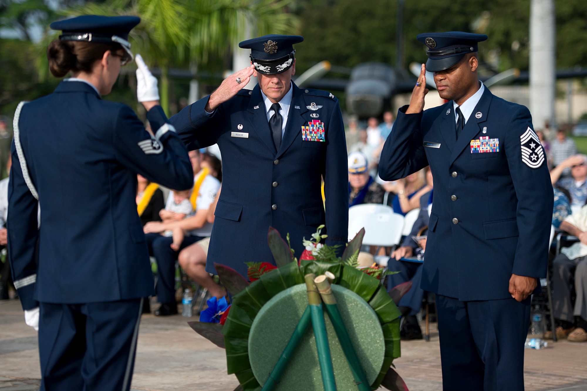 Col. Johnny Roscoe, 15th Wing commander, and Chief Master Sgt. Leslie Bramlett, 15th WG command chief master sergeant, salute a wreath to honor the victims of the attacks on the island Dec. 7, 1941, by the Japanese during the 71st anniversary remembrance ceremony on Joint Base Pearl Harbor-Hickam, Dec. 7, 2012. During the attacks, 189 Army Air Corps Airmen and civilians lost their lives and 303 were wounded. (U.S. Air Force photo/Staff Sgt. Mike Meares)