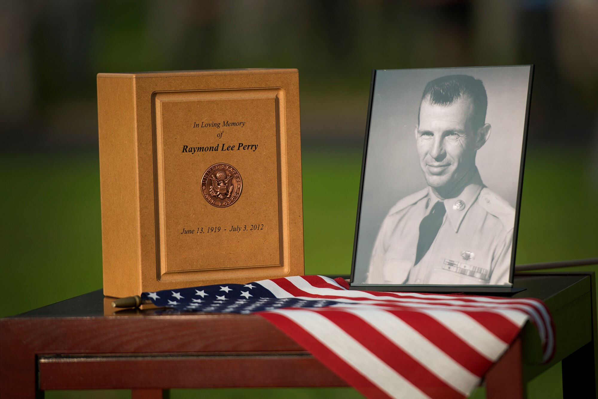Senior Master Sgt. (Ret.) Raymond Perry, attends his final remembrance ceremony alongside his wife, Elizabeth, during the 71st anniversary remembrance ceremony on Joint Base Pearl Harbor-Hickam, Dec. 7, 2012. Perry, a survivor of the attacks, went on to serve 26-years in the Air Force and was a founding member of the pararescue career field. He returned to Hickam and serve for more than 20 years as a fire inspector for the Hickam fire department. After the ceremony, the family and friends of Perry scattered his ashes in the waters of Pearl Harbor during a private ceremony.  (U.S. Air Force photo/Staff Sgt. Mike Meares)